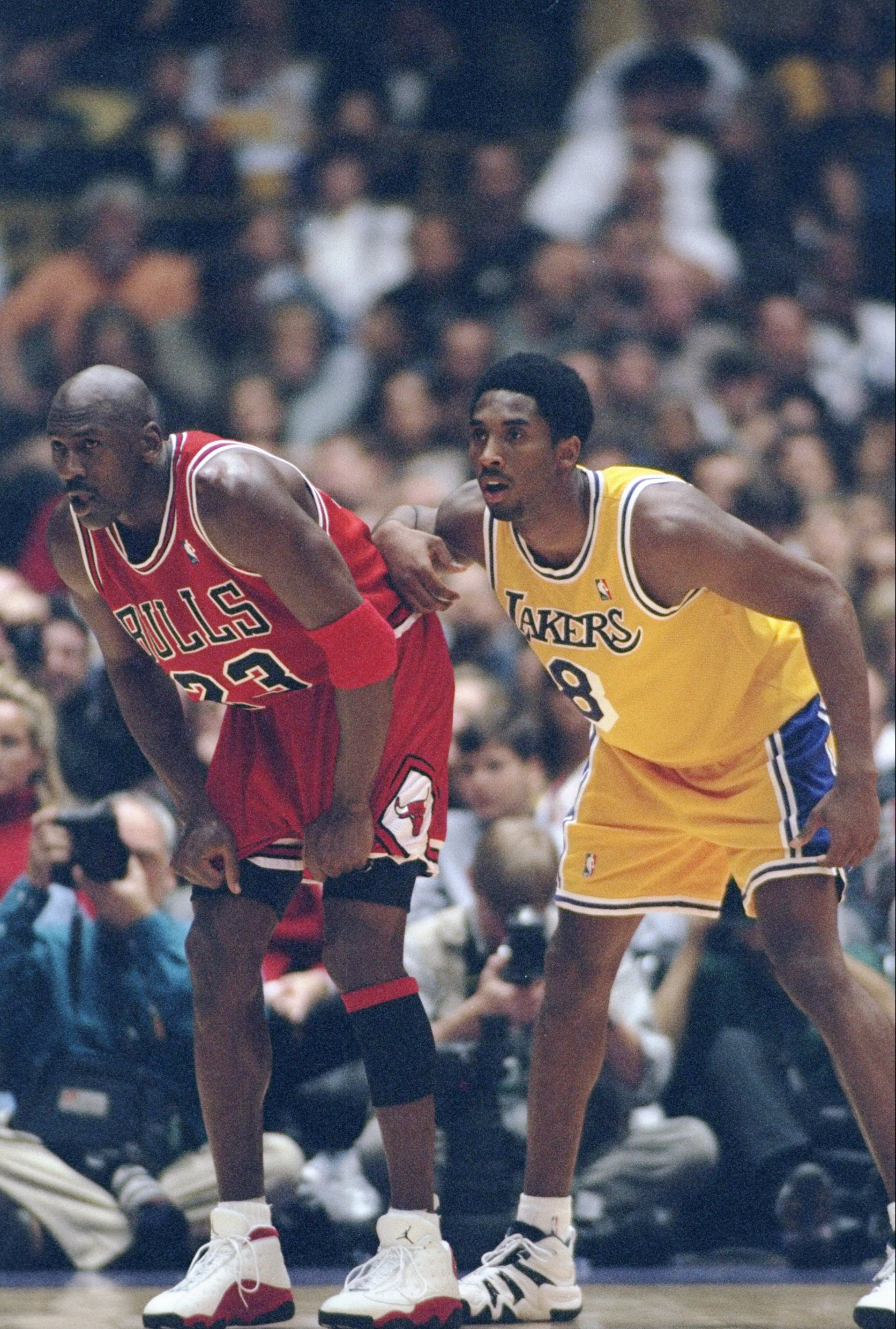 1 Feb 1998:  Guard Michael Jordan of the Chicago Bulls (left) and guard Kobe Bryant of the Los Angeles Lakers look on during a game at the Great Western Forum in Inglewood, California.  The Lakers won the game, 112-87. Mandatory Credit: Jed Jacobsohn  /Al