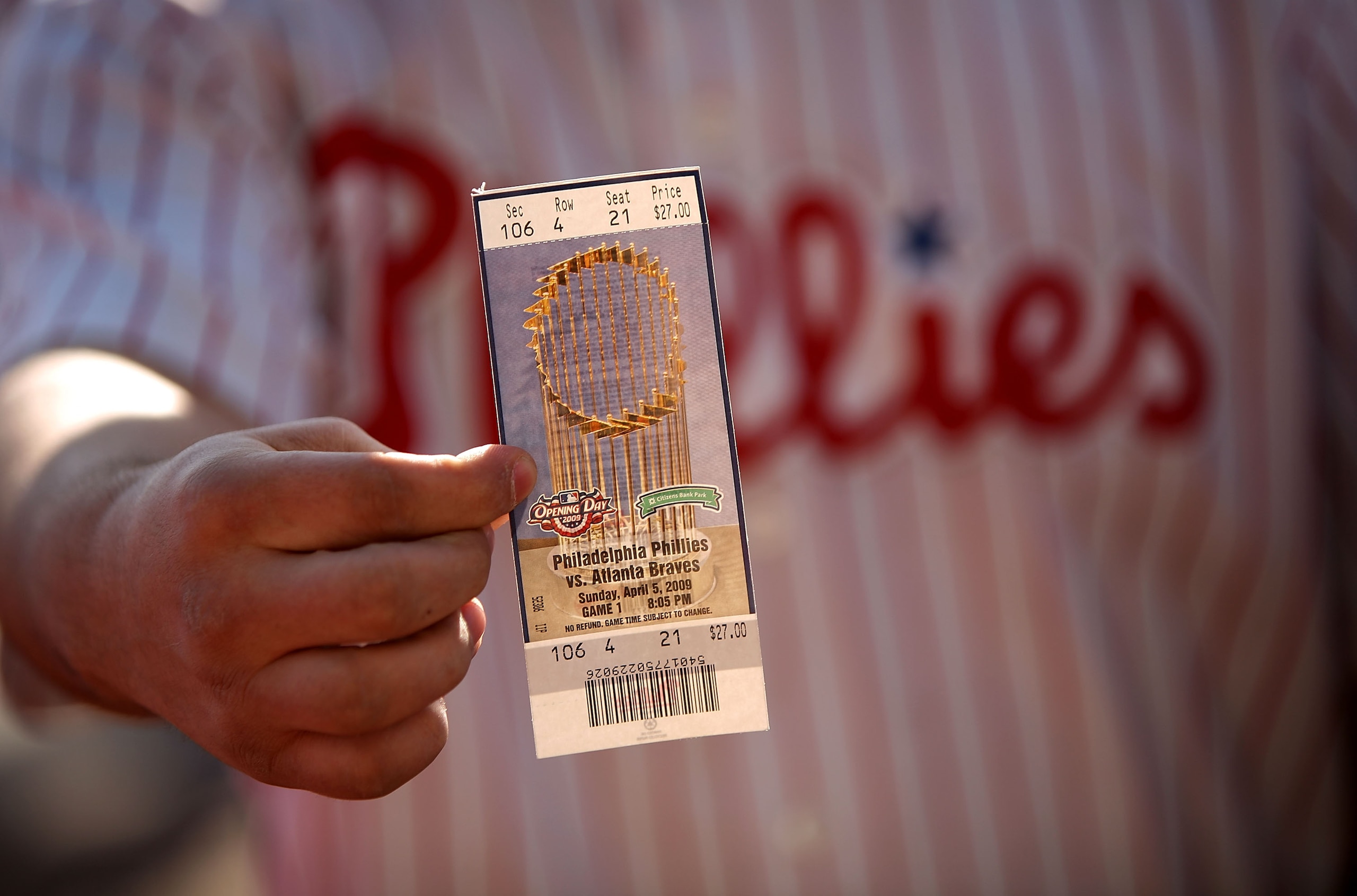 PHILADELPHIA - APRIL 05:  A Philadelphia Philliles fan shows his ticket to the Phillies game against the Atlanta Braves on April 5, 2009 at Citizens Bank Park in Philadelphia, Pennsylvania. Today's game is the opening of the 2009 major league baseball sea