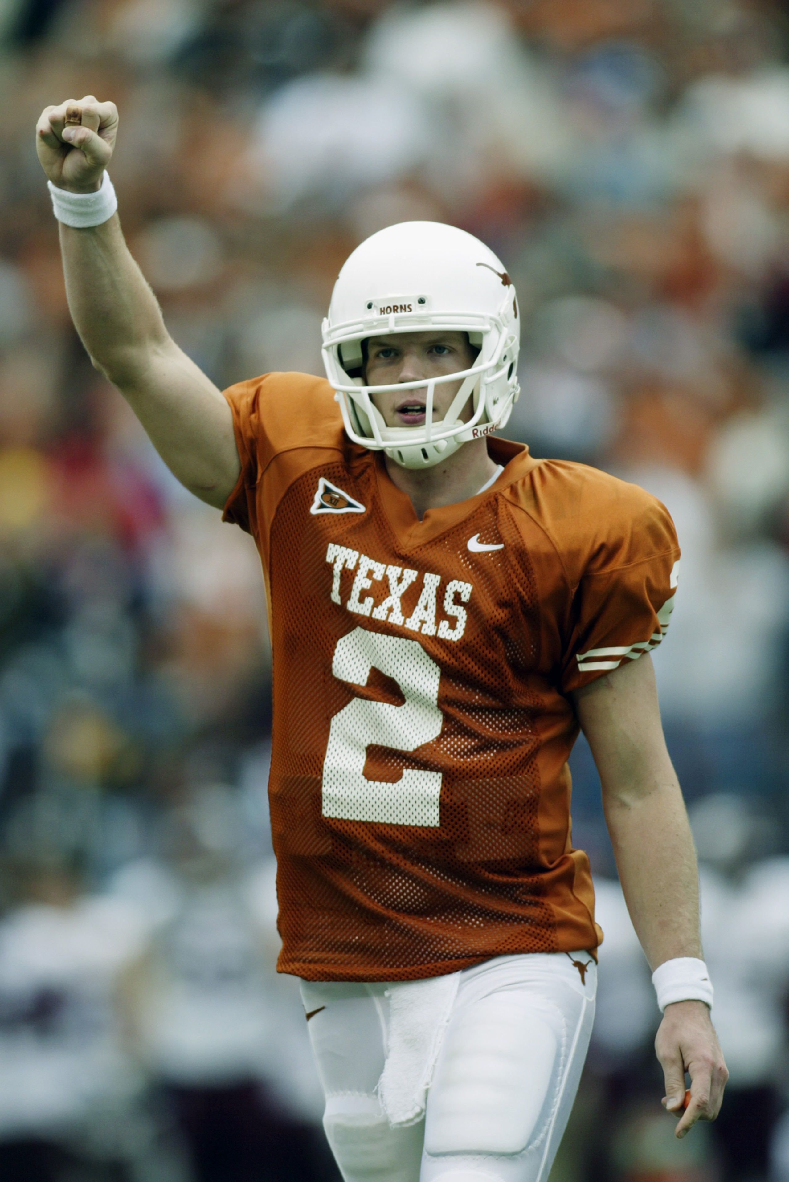 AUSTIN, TX - NOVEMBER 29:  Quarterback Chris Simms #2 of the University of Texas at Austin Longhorns pumps his fist after throwing a touchdown against the Texas A&M University Aggies during the game at Memorial Stadium on November 29, 2002 in Austin, Texa