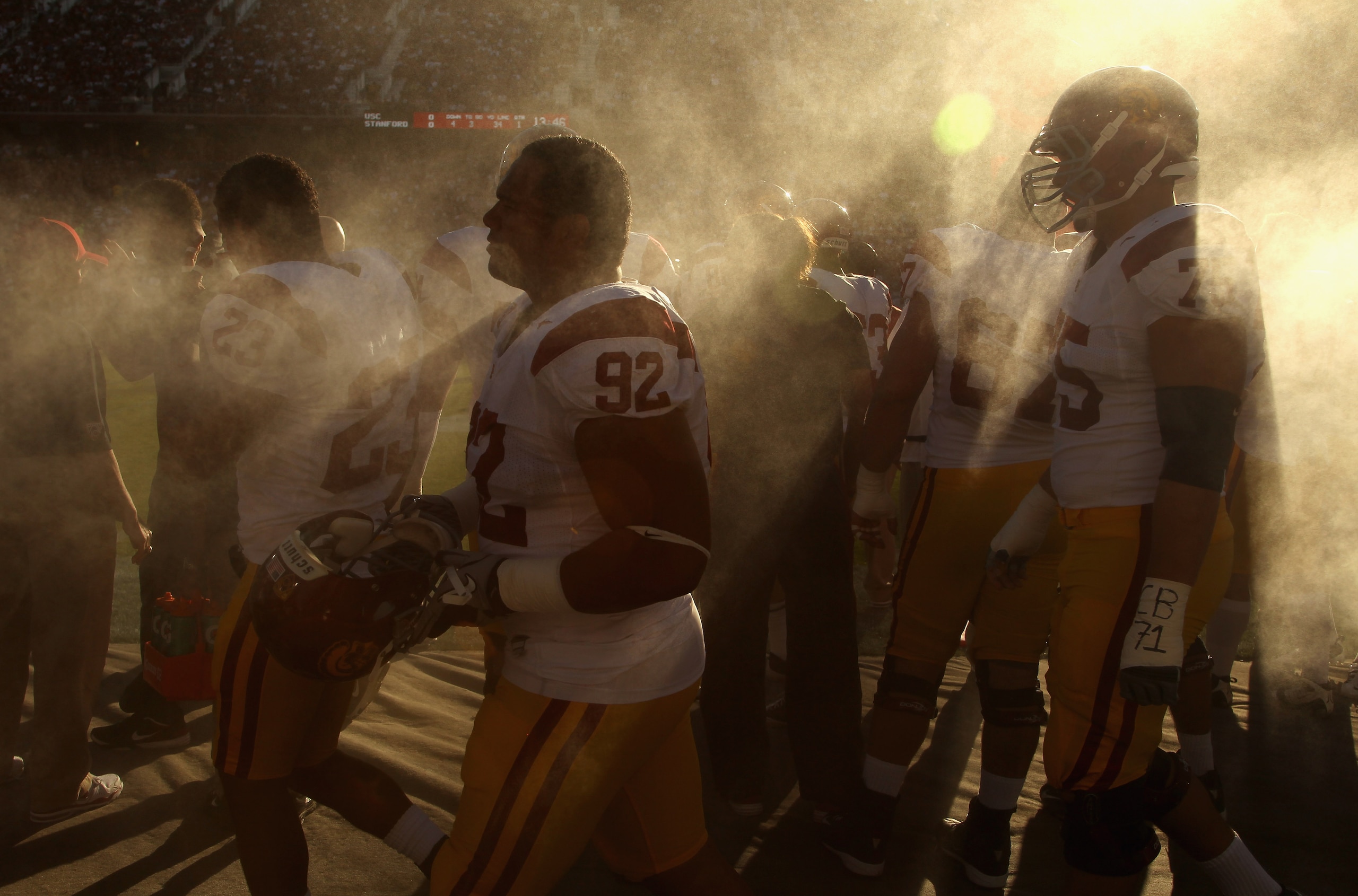 PALO ALTO, CA - OCTOBER 09: Hebron Fangupo #92 and Matt Kalil #75 of the USC Trojans walk by a spray fan during their game against the Stanford Cardinal at Stanford Stadium on October 9, 2010 in Palo Alto, California. (Photo by Ezra Shaw/Getty Images) PALO ALTO, CA - OCTOBER 09: Hebron Fangupo #92 and Matt Kalil #75 of the USC Trojans walk by a spray fan during their game against the Stanford Cardinal at Stanford Stadium on October 9, 2010 in Palo Alto, California. (Photo by Ezra Shaw/Getty Images)