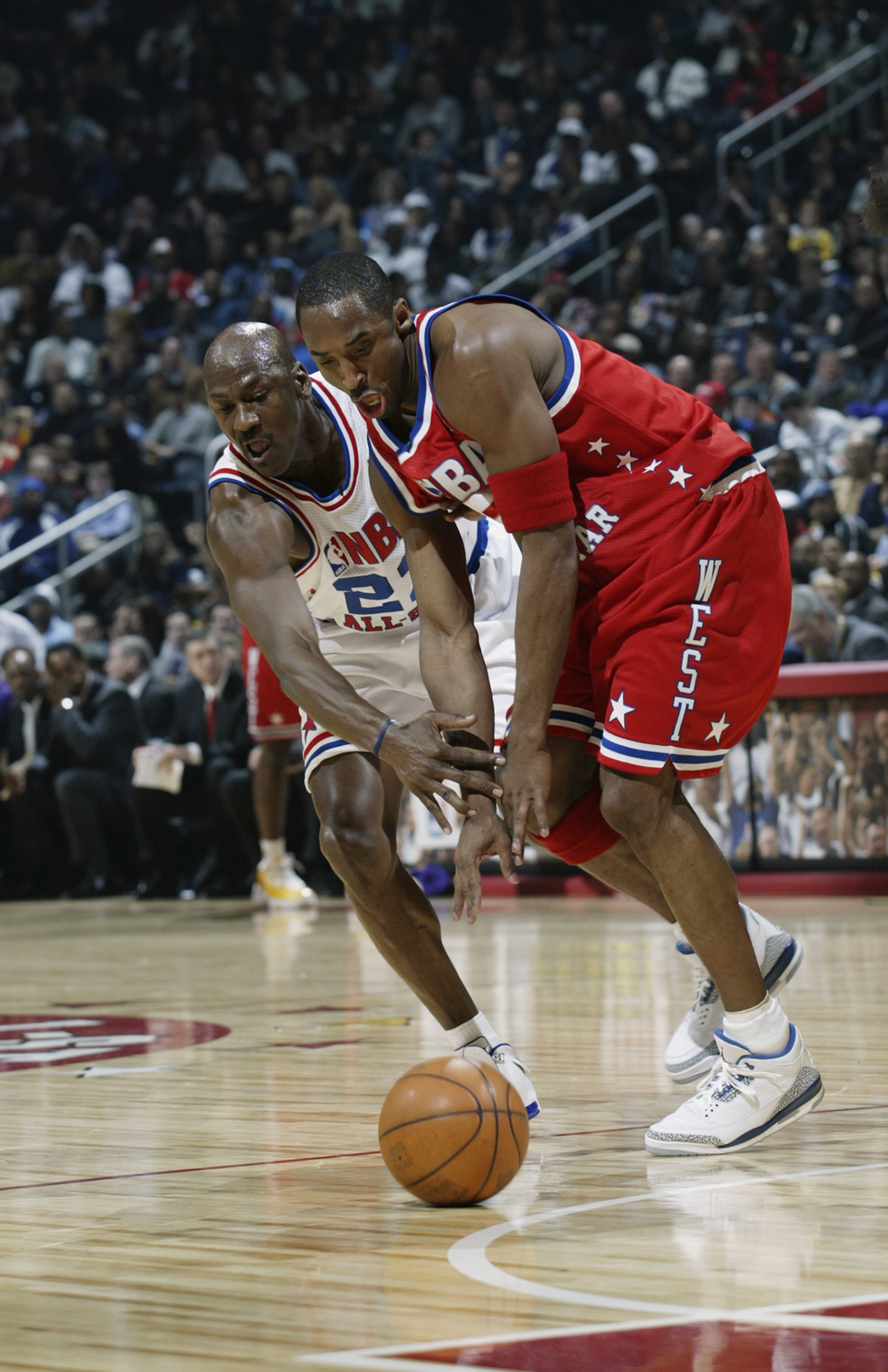 ATLANTA - FEBRUARY 9:  Kobe Bryant (Los Angeles Lakers) #8 of the Western Conference All Stars battles for possession with Michael Jordan (Washington Wizards) #23 of the Eastern Conference All Stars during the 2003 NBA All-Star Game on February 9, 2003 at