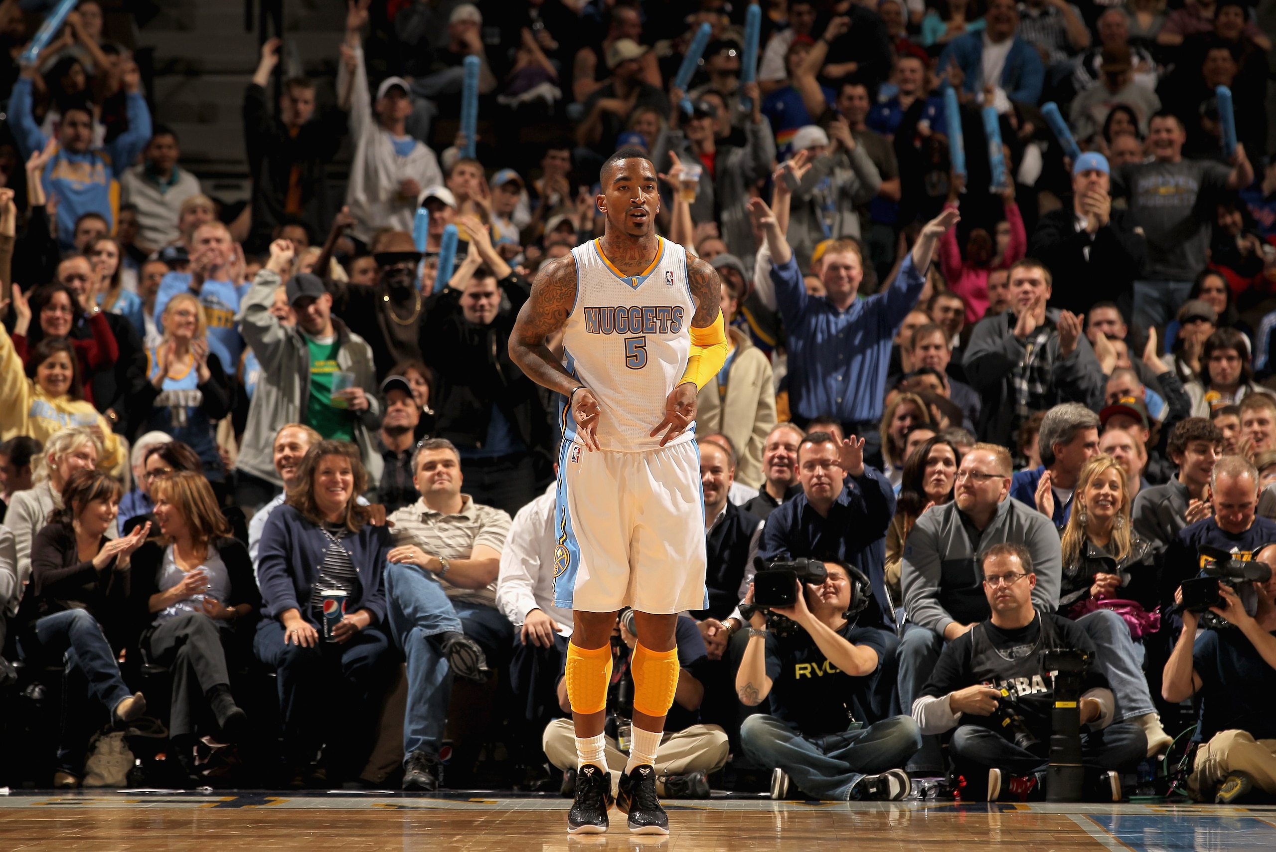 DENVER, CO - JANUARY 13: J.R. Smith #5 of the Denver Nuggets celebrates a three point basket against the Miami Heat at the Pepsi Center on January 13, 2011 in Denver, Colorado. The Nuggets defeated the Heat 130-102. NOTE TO USER: User expressly acknowled DENVER, CO - JANUARY 13: J.R. Smith #5 of the Denver Nuggets celebrates a three point basket against the Miami Heat at the Pepsi Center on January 13, 2011 in Denver, Colorado. The Nuggets defeated the Heat 130-102. NOTE TO USER: User expressly acknowled