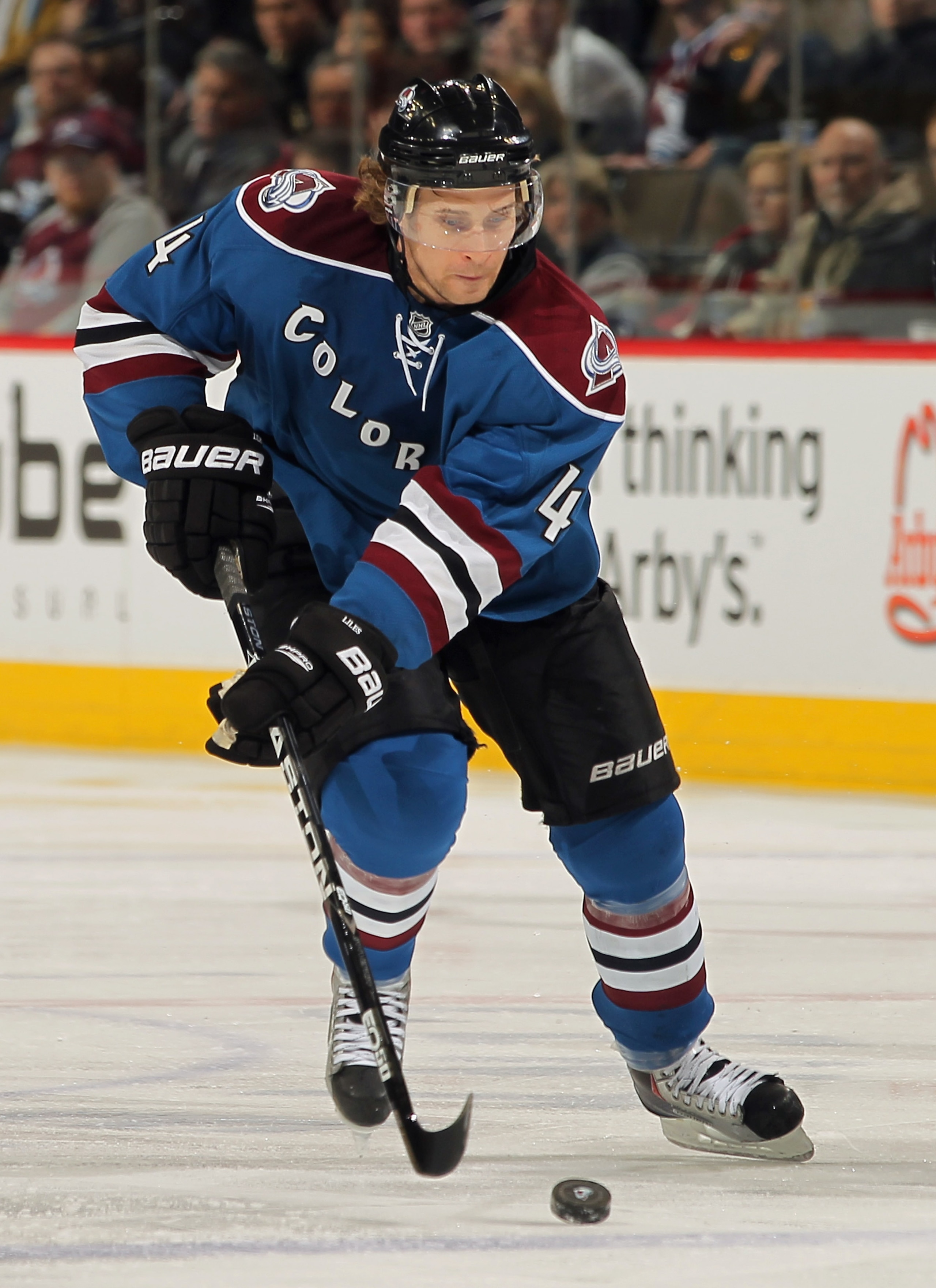 DENVER, CO - JANUARY 20:  John-Michael Liles #4 of the Colorado Avalanche controls the puck against the Nashville Predators at the Pepsi Center on January 20, 2011 in Denver, Colorado. The Predators defeated the Avalanche 5-1.  (Photo by Doug Pensinger/Ge