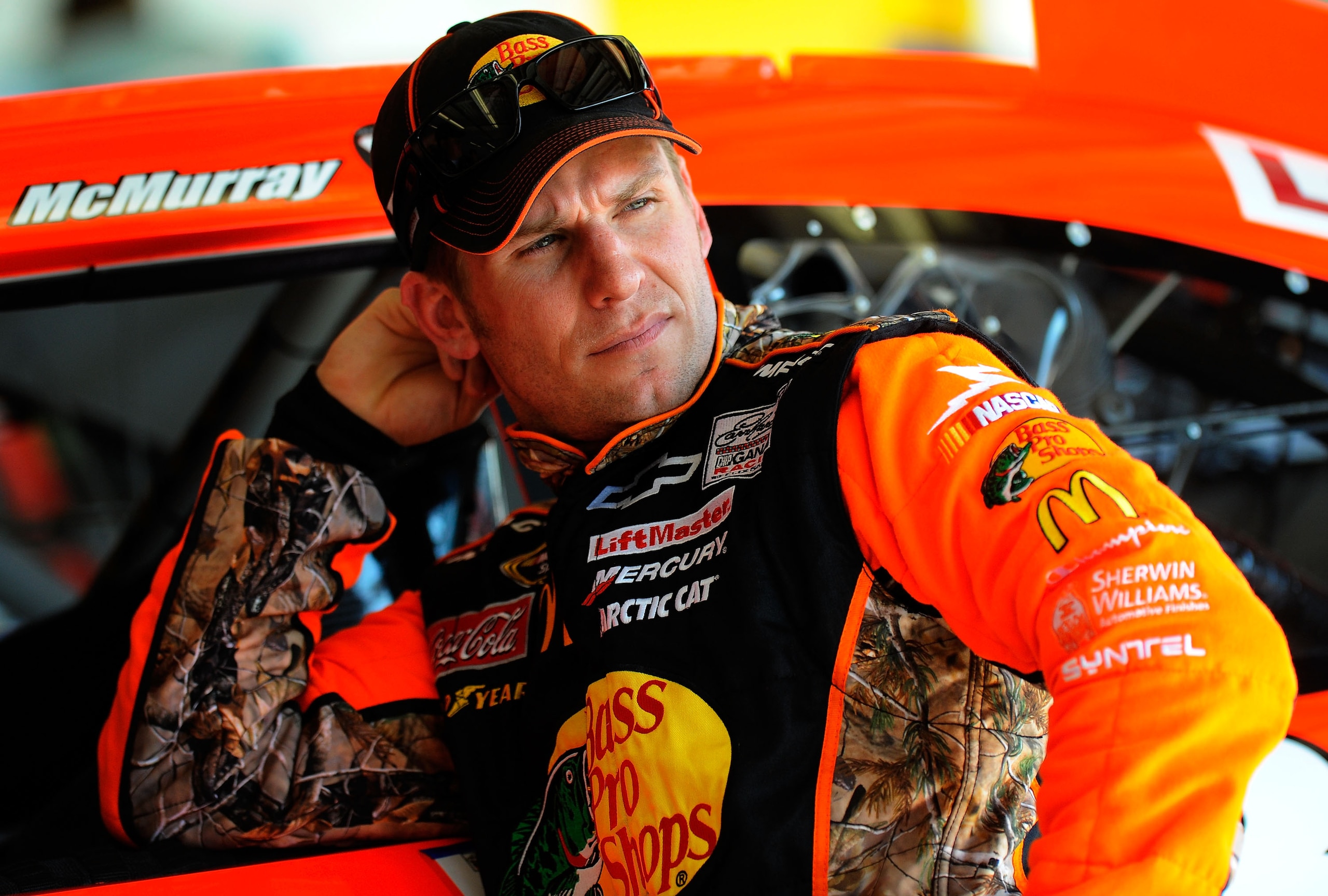 DAYTONA BEACH, FL - FEBRUARY 19:  Jamie McMurray, driver of the #1 Bass Pro Shops Chevrolet, looks on in the garage area during practice for the NASCAR Sprint Cup Series Daytona 500 at Daytona International Speedway on February 19, 2011 in Daytona Beach,