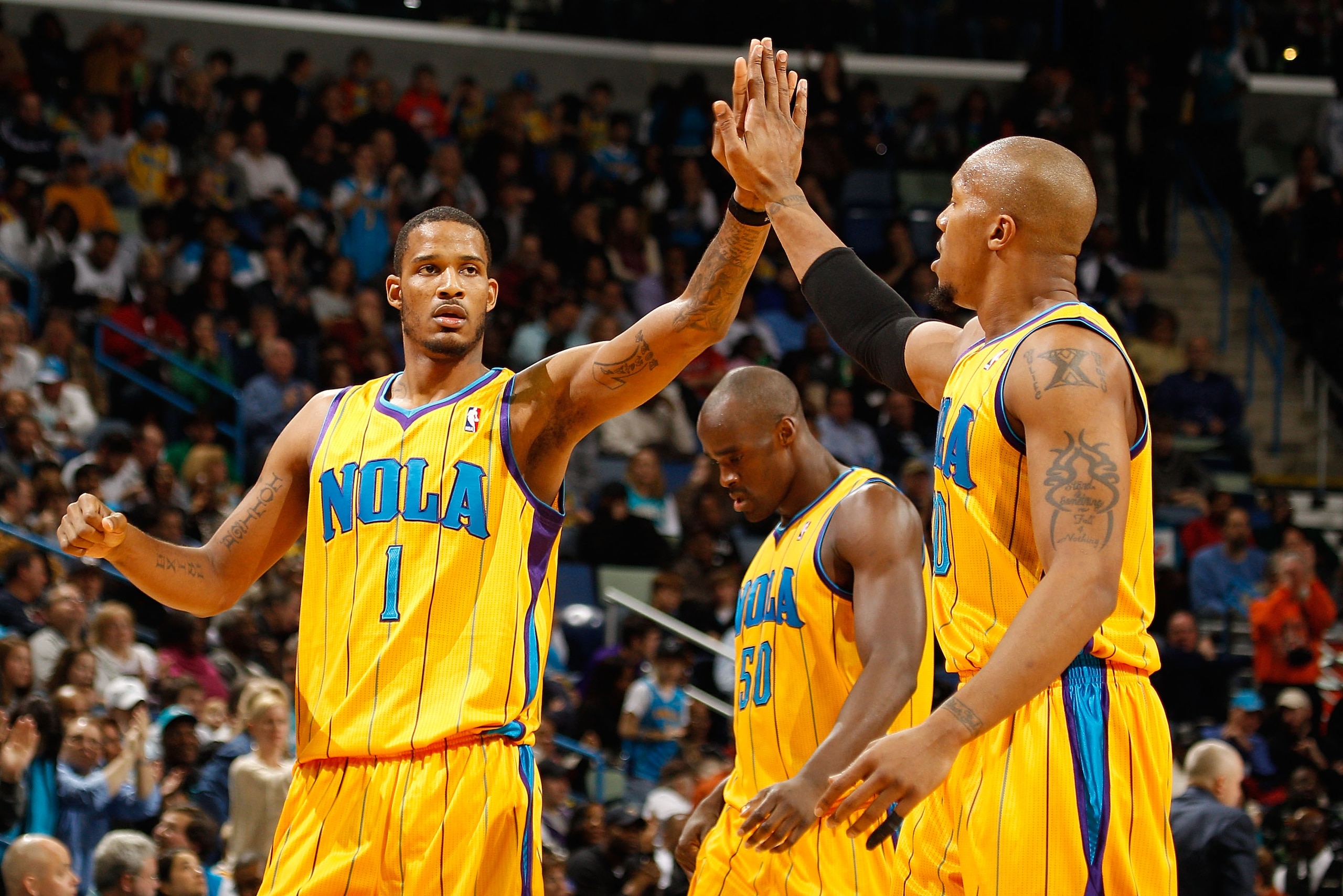 NEW ORLEANS, LA - JANUARY 22:  David West #30 and Trevor Ariza #1 of the New Orleans Hornets celebrate during the game against the San Antonio Spurs at the New Orleans Arena on January 22, 2011 in New Orleans, Louisiana.  The Hornets defeated the Spurs 96