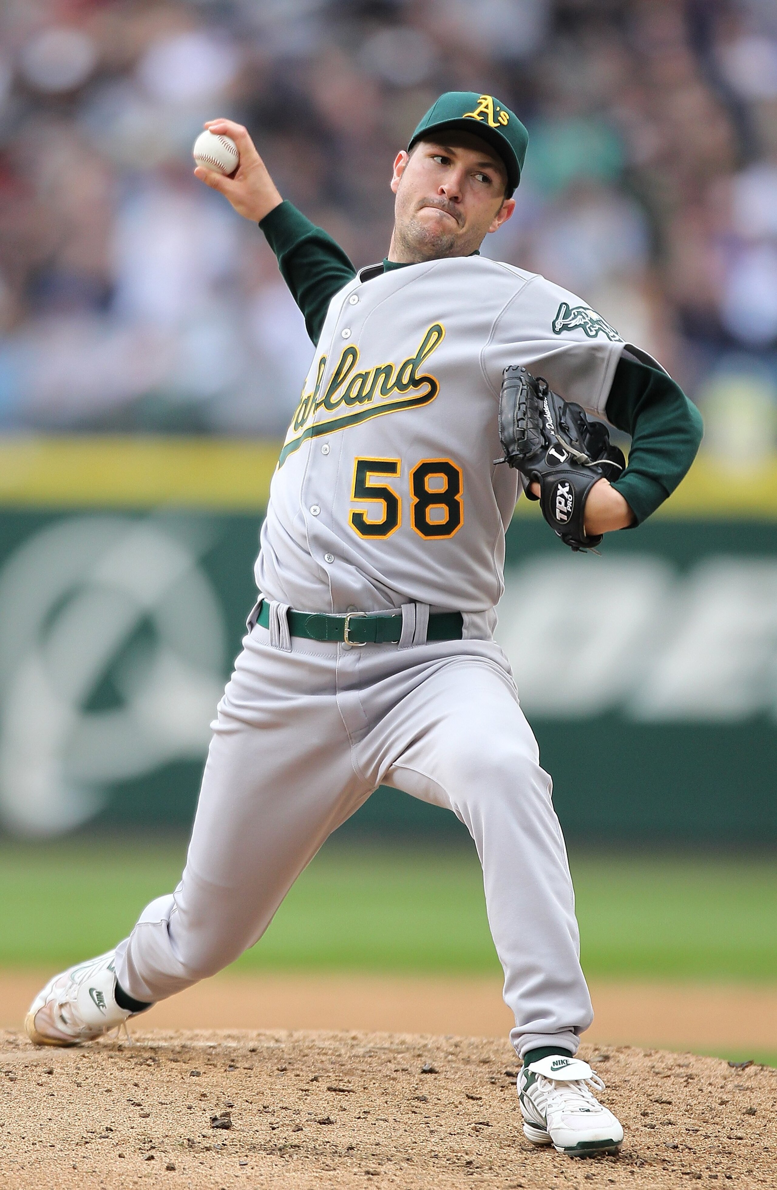SEATTLE - APRIL 12:  Starting pitcher Justin Duchscherer #58 of the the Oakland Athletics pitches against the Seattle Mariners during the Mariners' home opener at Safeco Field on April 12, 2010 in Seattle, Washington. (Photo by Otto Greule Jr/Getty Images
