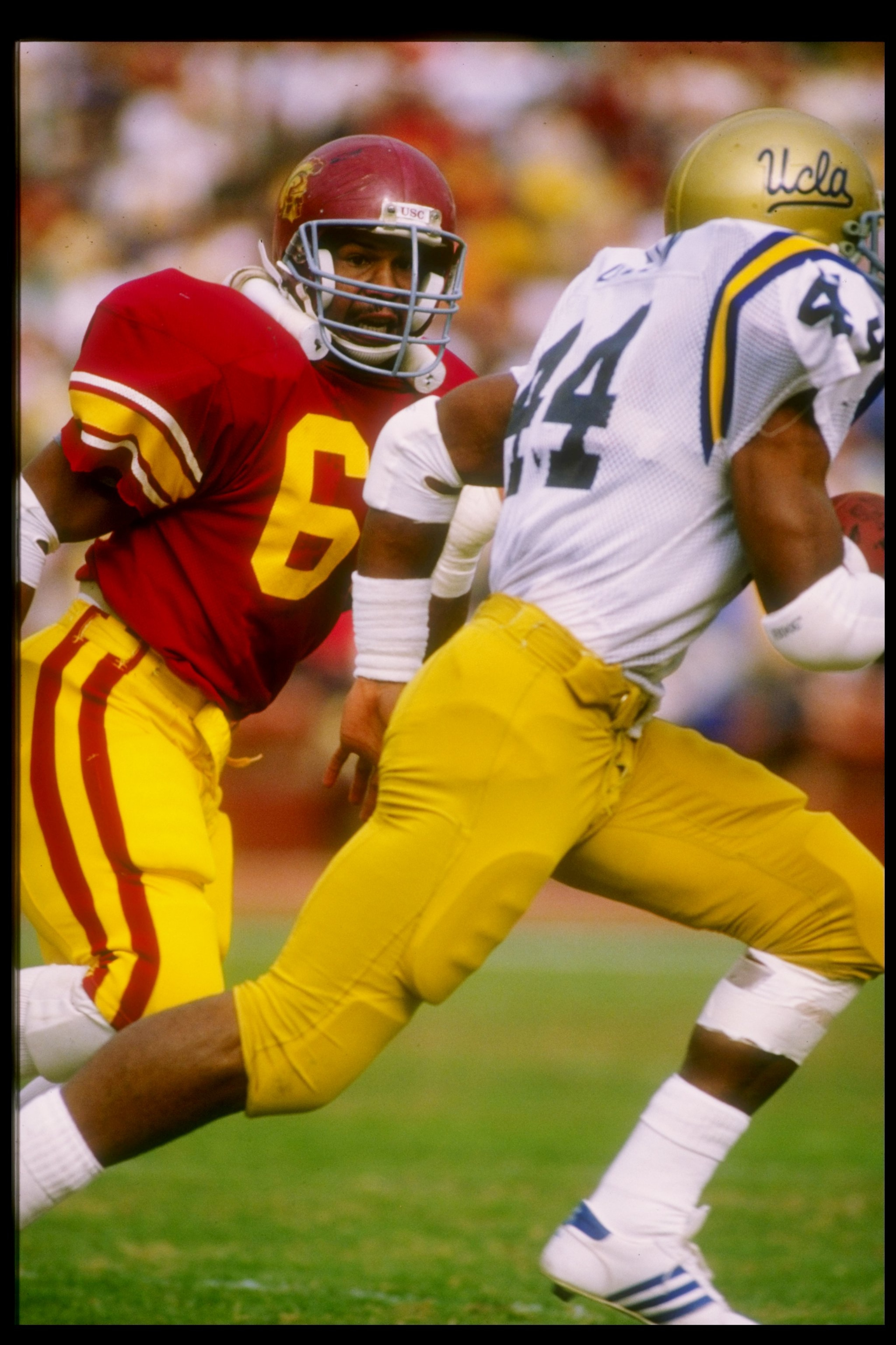23 Nov 1985:  Safety Tim McDonald of the USC Trojans chases after running back Gaston Green of the UCLA Bruins during a game at the Los Angeles Memorial Coliseum in Los Angeles, California.  USC won the game 17-13. Mandatory Credit: Mike Powell  /Allsport