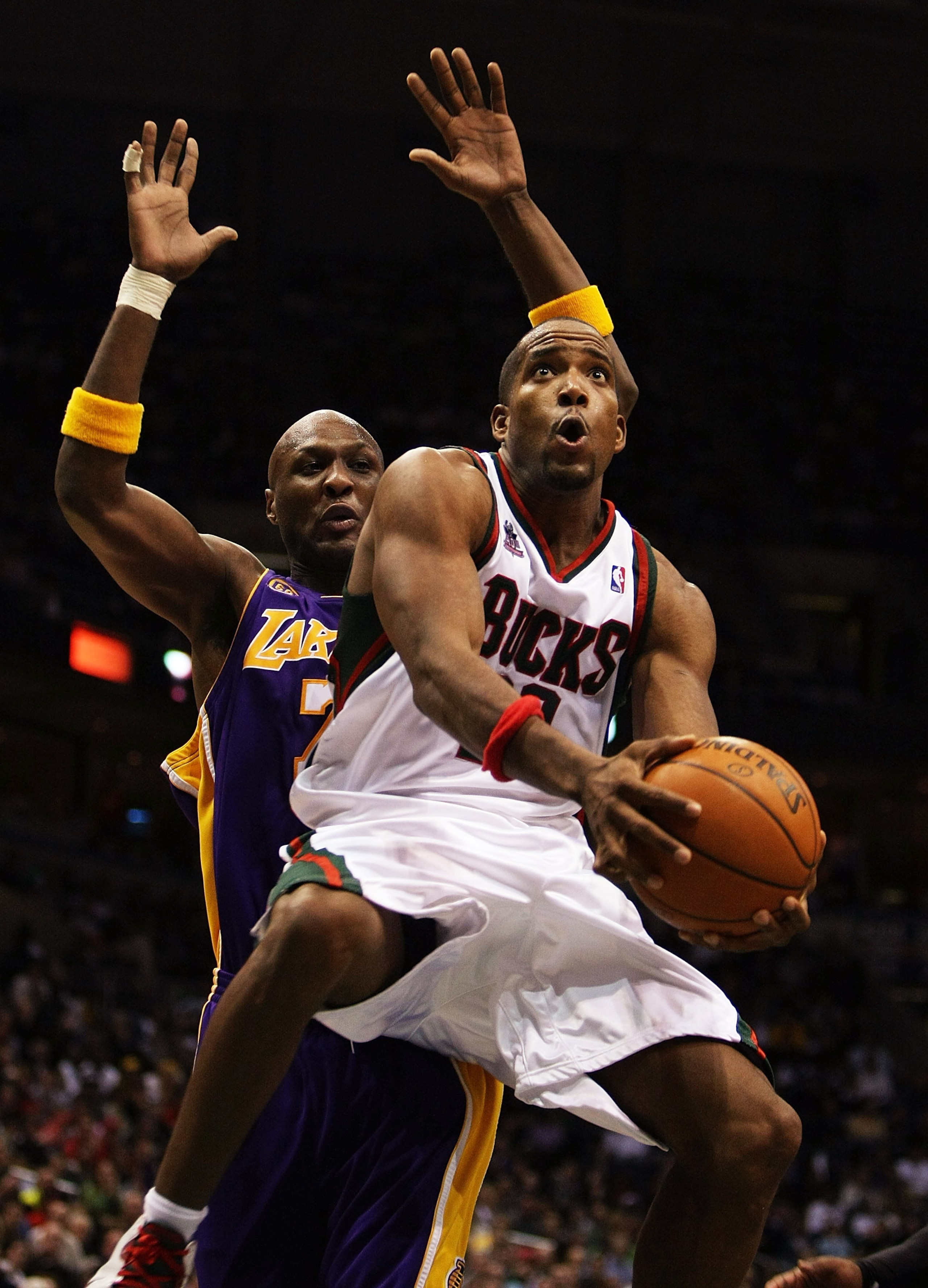 MILWAUKEE - NOVEMBER 21: Michael Redd #22 of the Milwaukee Bucks pus up a shot as Lamar Odom #7 of the Los Angeles Lakers defends on November 21, 2007 at the Bradley Center in Milwaukee, Wisconsin. The Bucks defeated the Lakers 110-103. NOTE TO USER: User