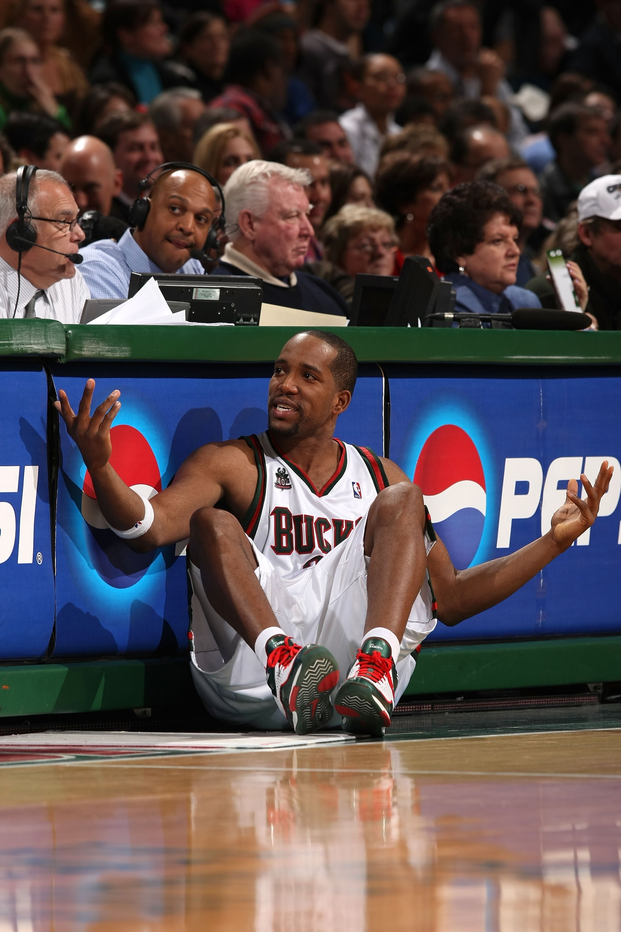 MILWAUKEE - JANUARY 22:  Michael Redd #22 of the Milwaukee Bucks gestures as he sits next to the scorer's table against the Phoenix Suns at the Bradley Center on January 22, 2008 in Milwaukee, Wisconsin. The Suns won 114-105. NOTE TO USER: User expressly