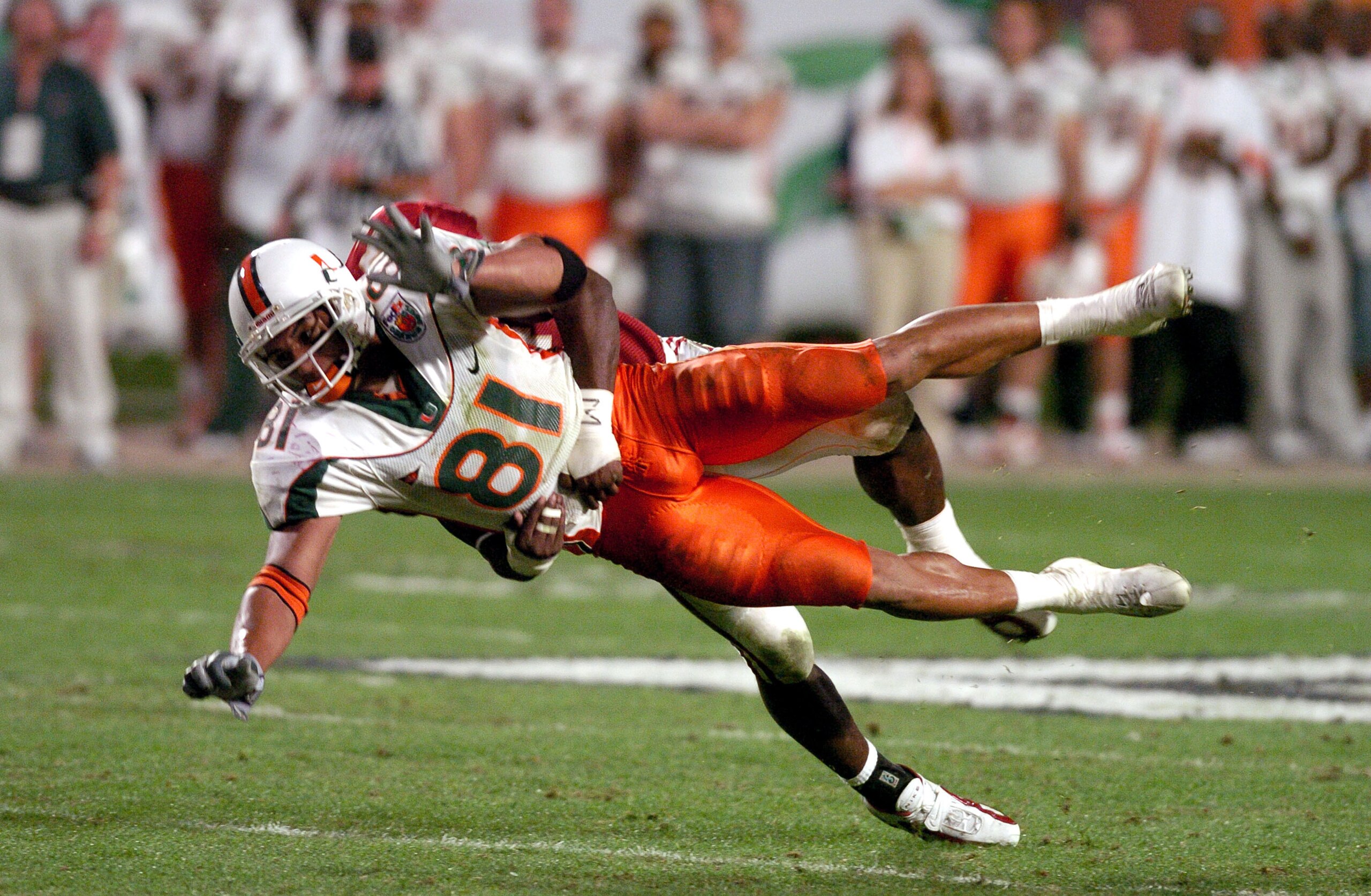 Miami's Kellen Winslow get's hit attempting to make a catch in the third quarter of action during the 70th Annual FedEx Orange Bowl at Pro Player Stadium in Miami, Florida, January 1, 2004. (Photo by A. Messerschmidt/Getty Images) *** Local Caption ***