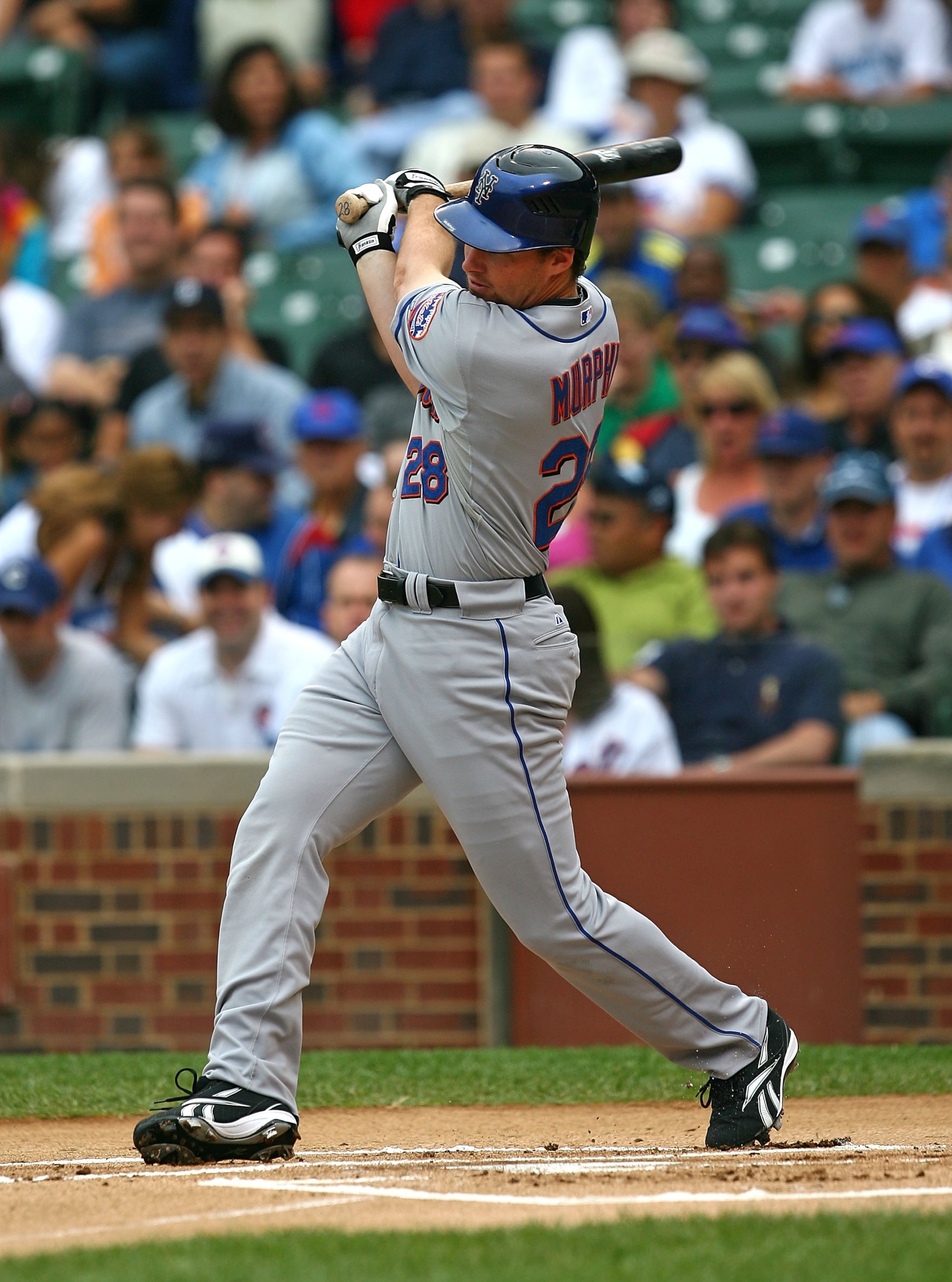 CHICAGO - AUGUST 28: Daniel Murphy #28 of the New York Mets hits the ball against the Chicago Cubs on August 28, 2009 at Wrigley Field in Chicago, Illinois. The Cubs defeated the Mets 5-2. (Photo by Jonathan Daniel/Getty Images)