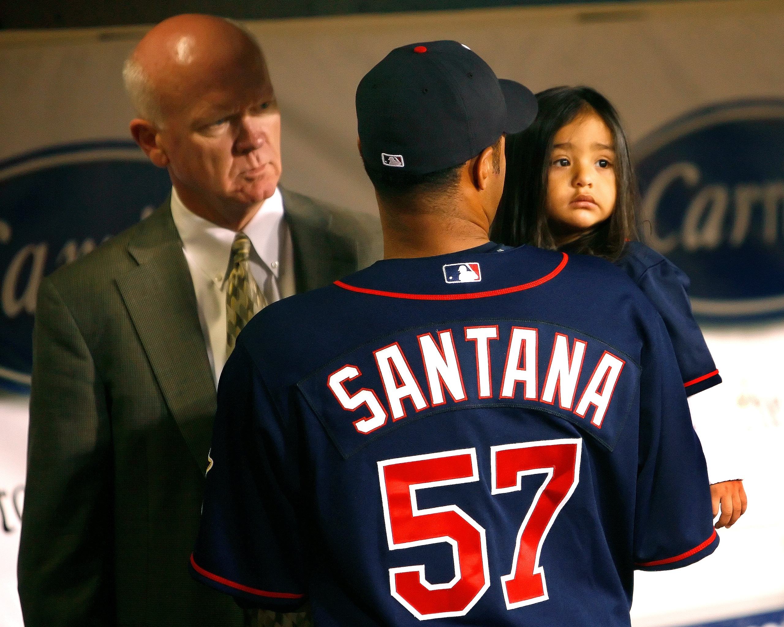 MINNEAPOLIS, MN - APRIL 14: Johan Santana #57 of the Twins and daughter Jasmily and Twins General Manager Terry Ryan get ready for the Cy Young Award presentation April 14, 2007 at the Metrodome in Minneapolis, Minnesota. (Photo by Scott A. Schneider/Gett MINNEAPOLIS, MN - APRIL 14: Johan Santana #57 of the Twins and daughter Jasmily and Twins General Manager Terry Ryan get ready for the Cy Young Award presentation April 14, 2007 at the Metrodome in Minneapolis, Minnesota. (Photo by Scott A. Schneider/Gett