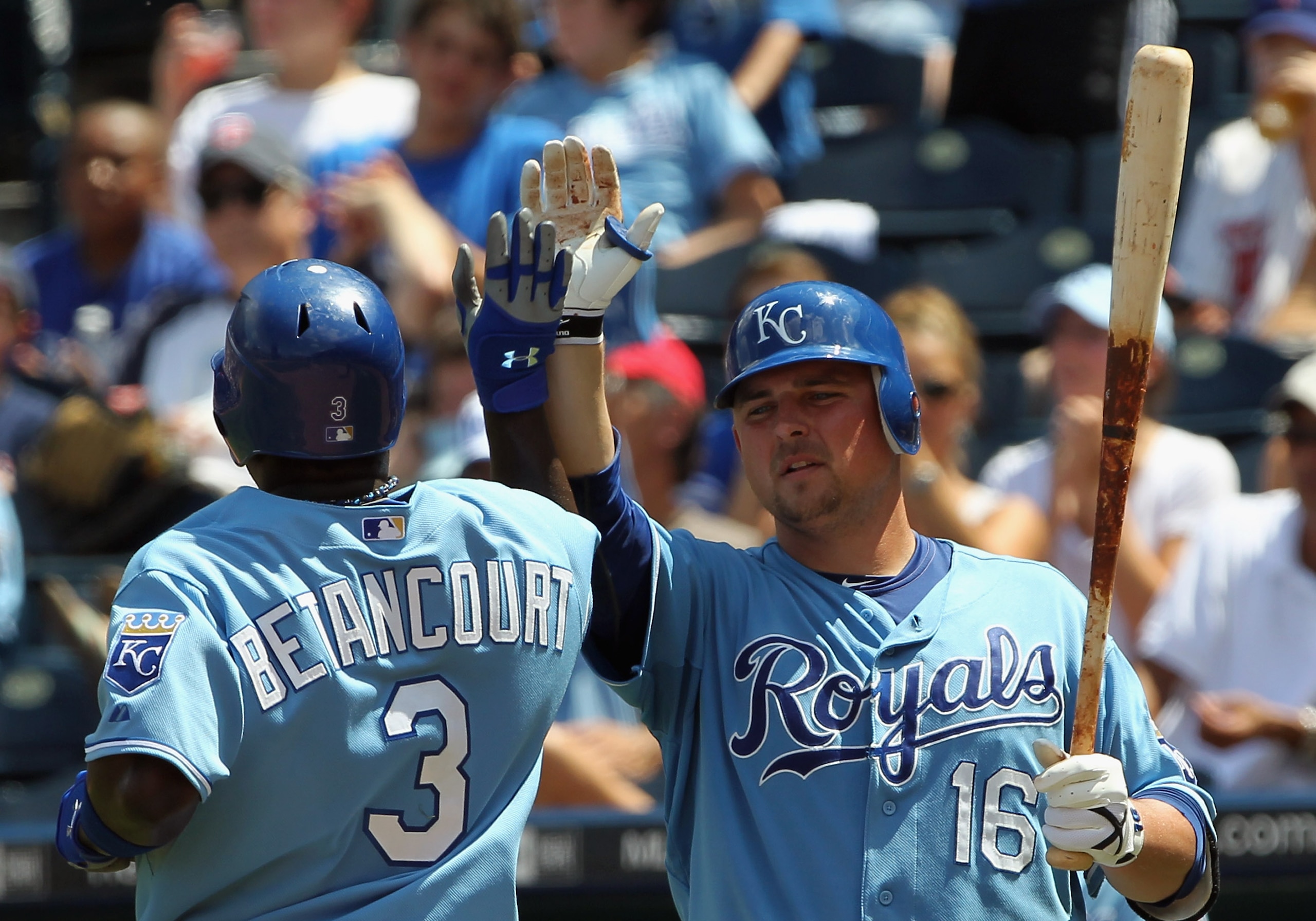 KANSAS CITY, MO - JULY 28:  Billy Butler #16 of the Kansas City Royals congratulates Yuniesky Betancourt #3 after a run during the game against  the Minnesota Twins on July 28, 2010 at Kauffman Stadium in Kansas City, Missouri.  (Photo by Jamie Squire/Get