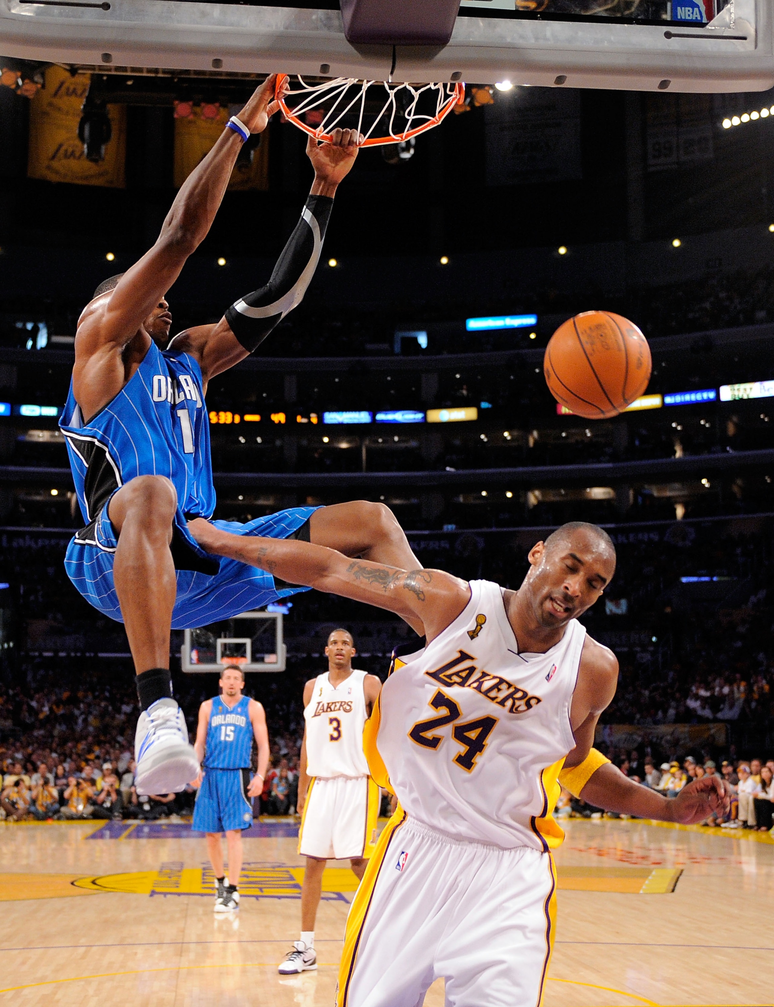 LOS ANGELES, CA - JUNE 07:  Dwight Howard #12 of the Orlando Magic dunks the ball over Kobe Bryant #24 of the Los Angeles Lakers in Game Two of the 2009 NBA Finals at Staples Center on June 7, 2009 in Los Angeles, California. NOTE TO USER: User expressly