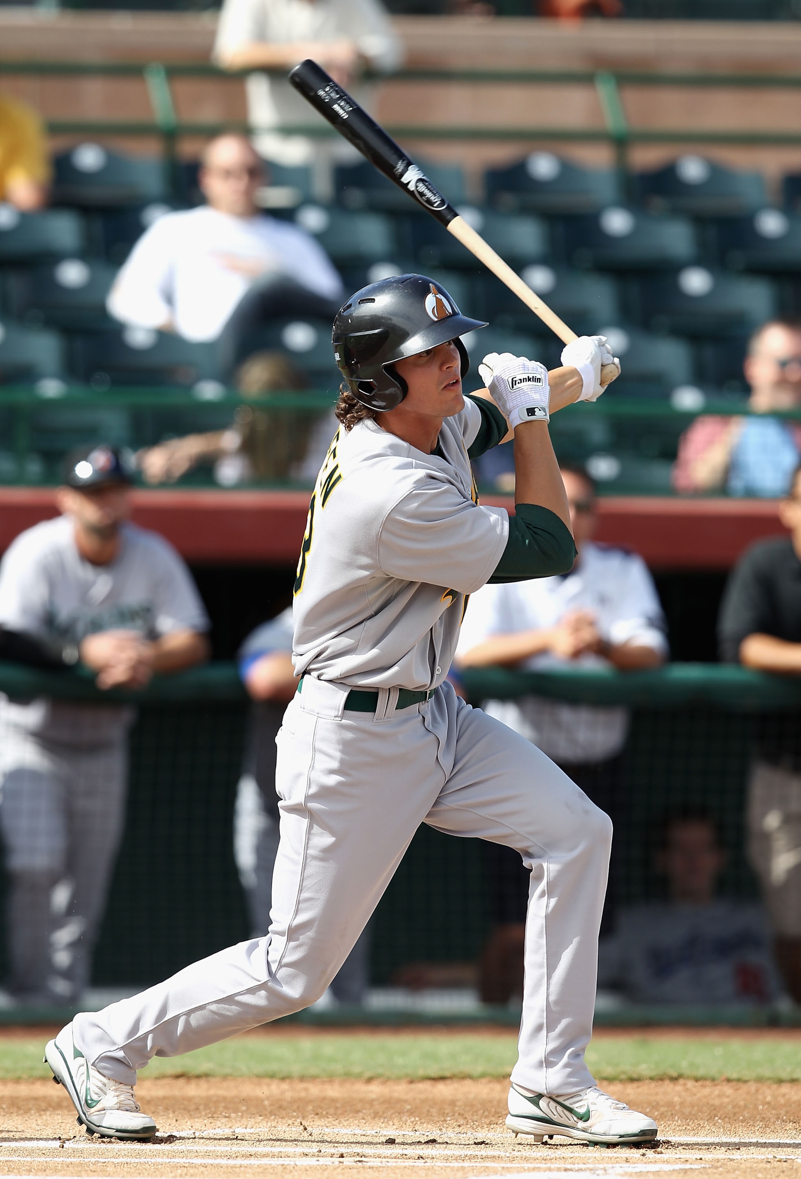 SCOTTSDALE, AZ - OCTOBER 23: Oakland Athletics prospect Grant Green playing for the Phoenix Desert Dogs hits a single against the Scottsdale Scorpions during the AZ Fall League game at Scottsdale Stadium on October 23, 2010 in Scottsdale, Arizona. (Phot SCOTTSDALE, AZ - OCTOBER 23: Oakland Athletics prospect Grant Green playing for the Phoenix Desert Dogs hits a single against the Scottsdale Scorpions during the AZ Fall League game at Scottsdale Stadium on October 23, 2010 in Scottsdale, Arizona. (Phot