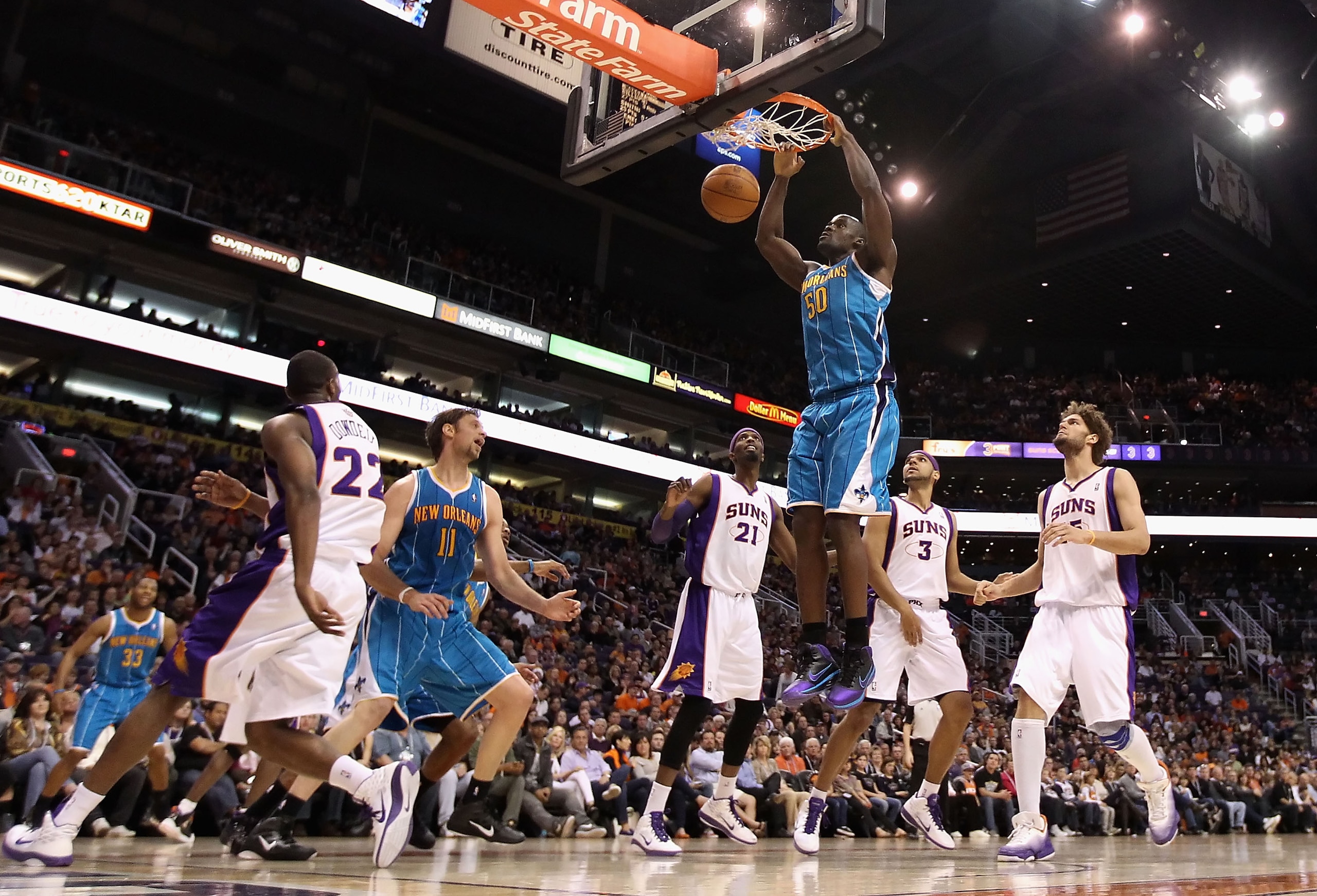 PHOENIX, AZ - JANUARY 30:  Emeka Okafor #50 of the New Orleans Hornets slam dunks the ball against the Phoenix Suns during the NBA game at US Airways Center on January 30, 2011 in Phoenix, Arizona.  NOTE TO USER: User expressly acknowledges and agrees tha