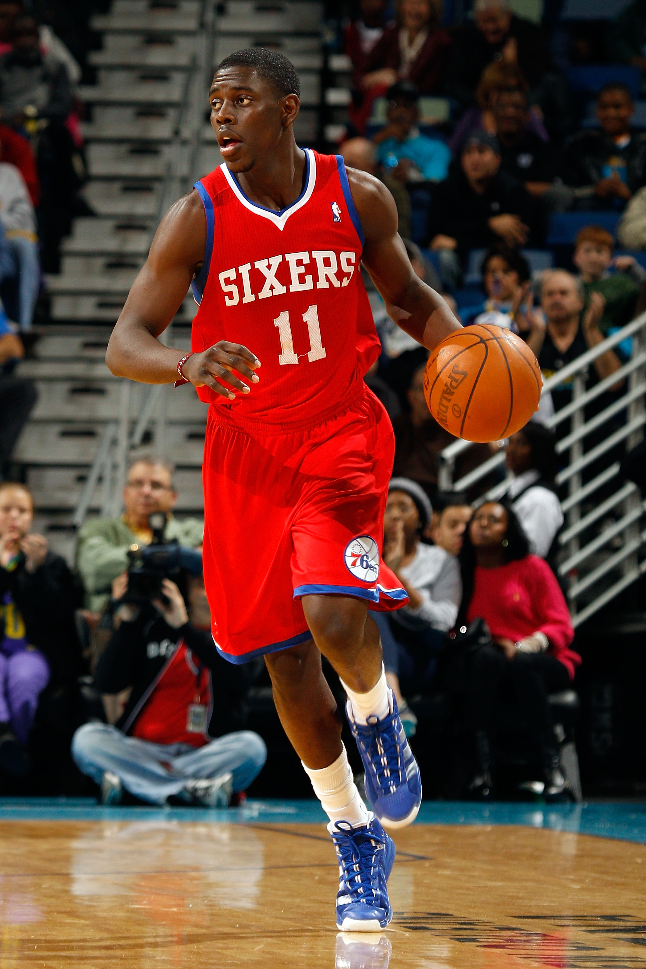 NEW ORLEANS, LA - JANUARY 03:  Jrue Holiday #11 of the Philadelphia 76ers moves the ball against the New Orleans Hornets at New Orleans Arena on January 3, 2011 in New Orleans, Louisiana. NOTE TO USER: User expressly acknowledges and agrees that, by downl