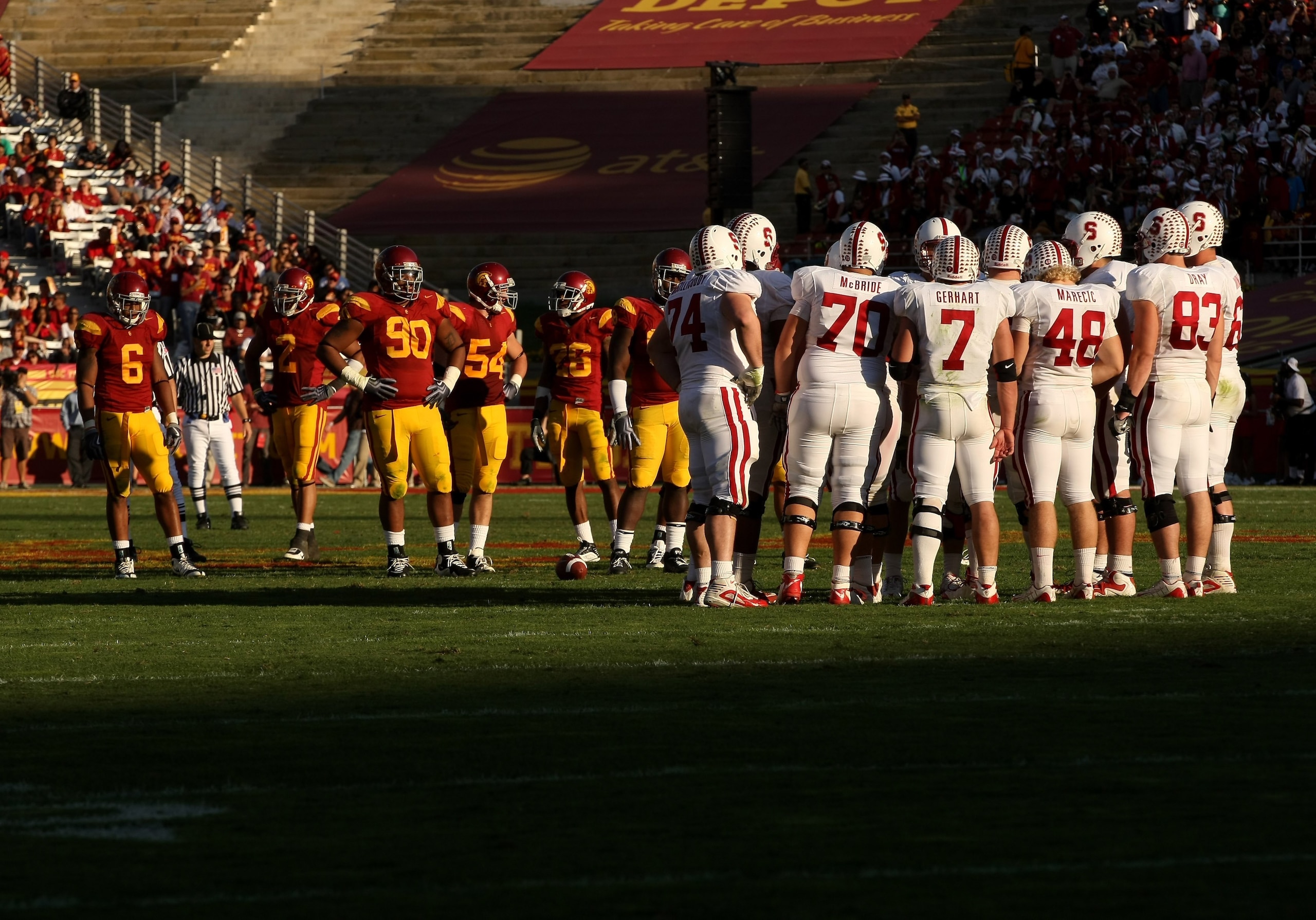 LOS ANGELES, CA - NOVEMBER 14: The Stanford Cardinal offense huddles as the USC Trojans defense waits on November 14, 2009 at the Los Angeles Coliseum in Los Angeles, California. Stanford won 55-21. (Photo by Stephen Dunn/Getty Images) LOS ANGELES, CA - NOVEMBER 14: The Stanford Cardinal offense huddles as the USC Trojans defense waits on November 14, 2009 at the Los Angeles Coliseum in Los Angeles, California. Stanford won 55-21. (Photo by Stephen Dunn/Getty Images)