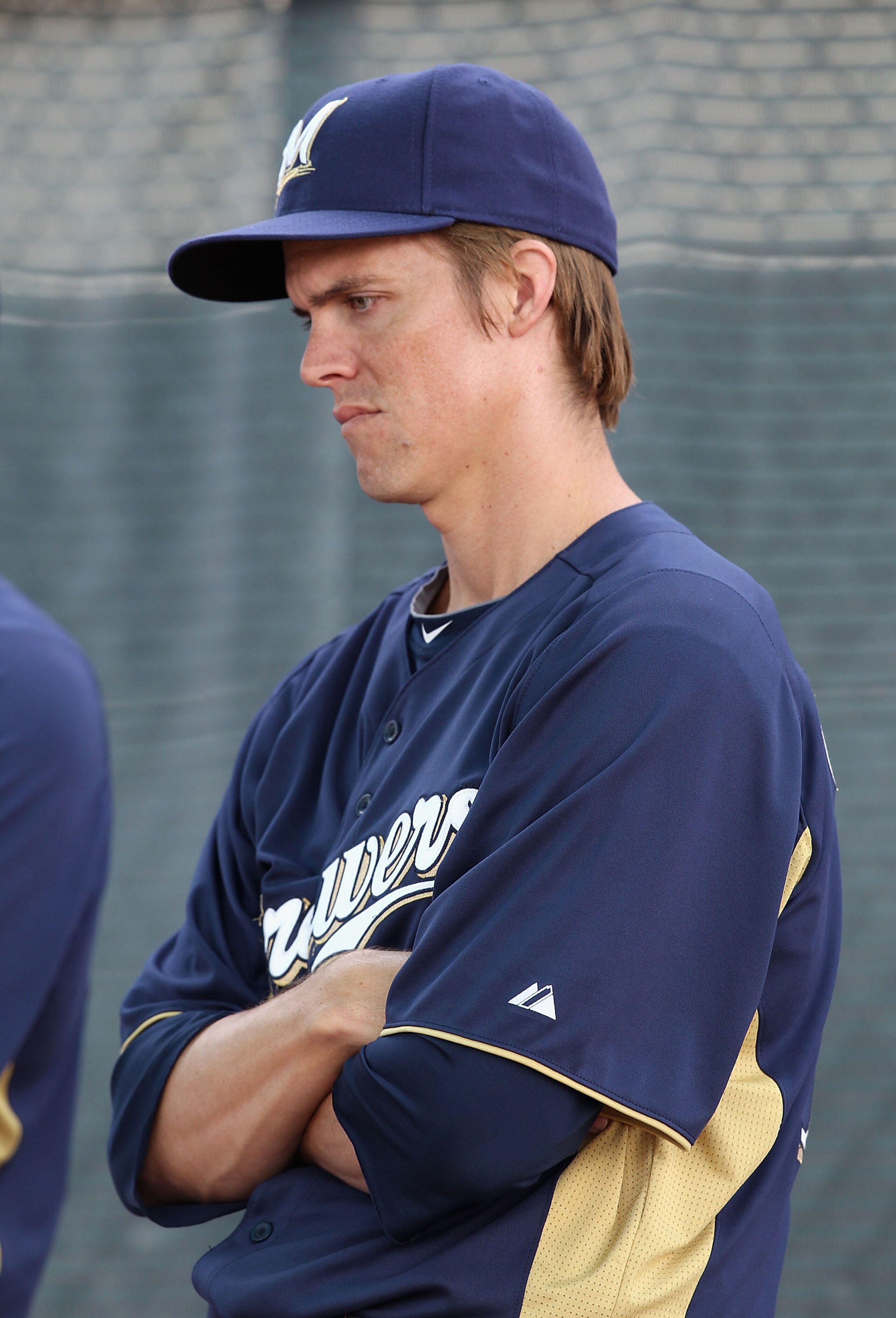 PHOENIX, AZ - FEBRUARY 18:  Pitcher Zack Greinke #13 of the Milwaukee Brewers warms up during a MLB spring training practice at Maryvale Baseball Park on February 18, 2011 in Phoenix, Arizona.  (Photo by Christian Petersen/Getty Images)