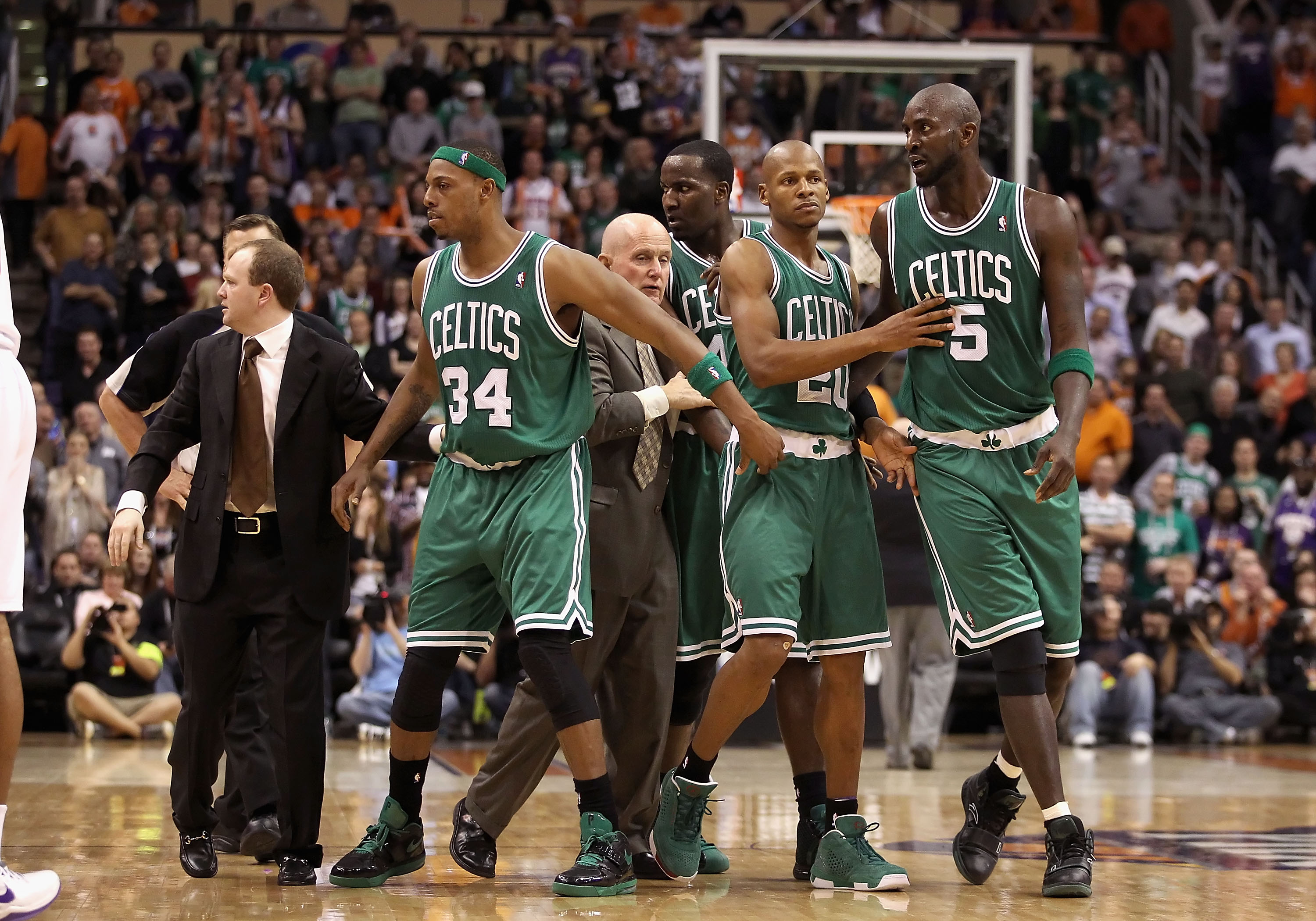 PHOENIX, AZ - JANUARY 28:  Assistant coach Lawrence Frank of the Boston Celtics walks Paul Pierce #34, Ray Allen #20 and Kevin Garnett #5 back to the bench after an altercation against the Phoenix Suns during the NBA game at US Airways Center on January 2