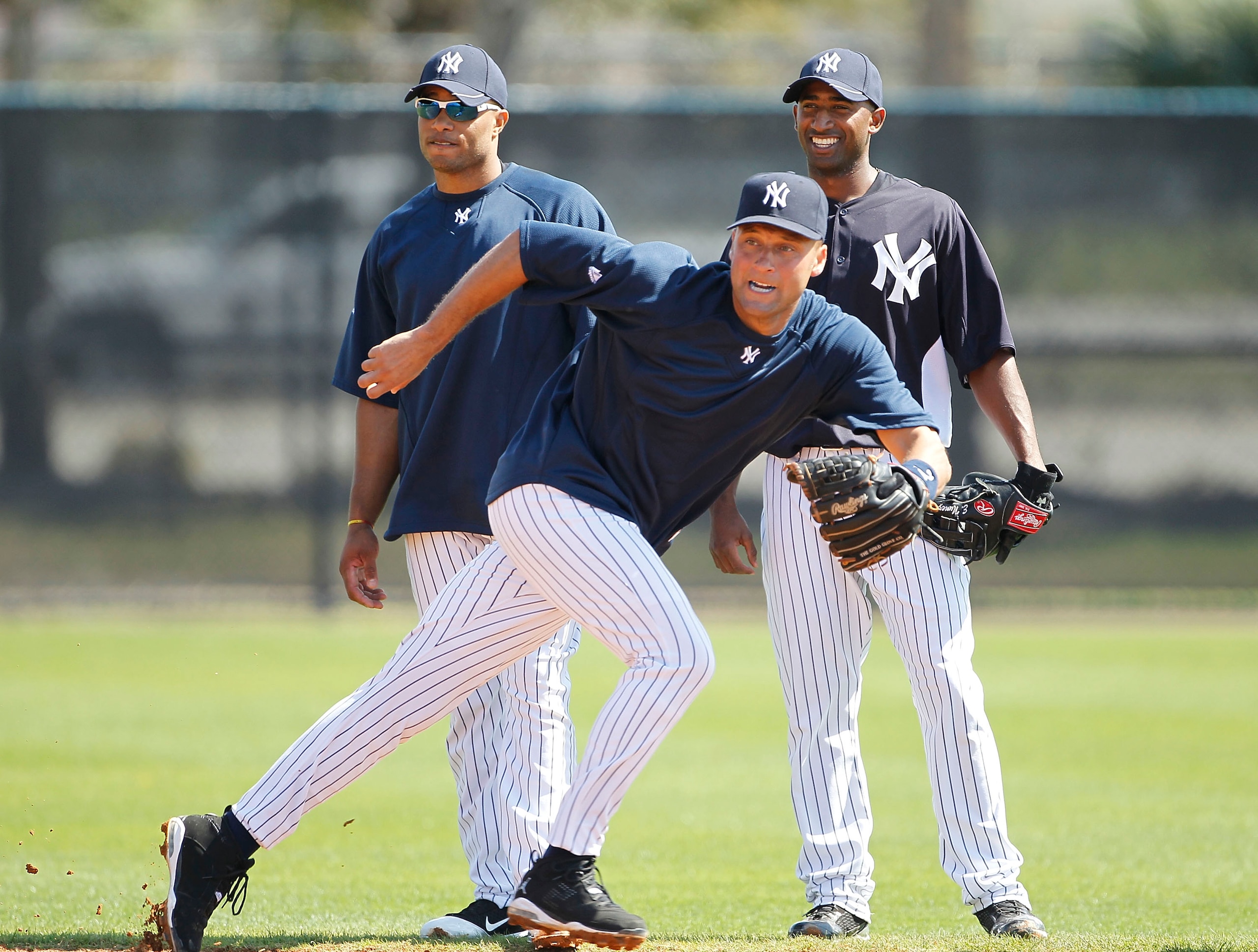 TAMPA, FL - FEBRUARY 21: Derek Jeter #2 of the New York Yankees breaks for a ground ball as Robinson Cano #24 and Eduardo Nunez #67 look on during the second day of full teams workouts at Spring Training on February 21, 2011 at the George M. Steinbrenner TAMPA, FL - FEBRUARY 21: Derek Jeter #2 of the New York Yankees breaks for a ground ball as Robinson Cano #24 and Eduardo Nunez #67 look on during the second day of full teams workouts at Spring Training on February 21, 2011 at the George M. Steinbrenner