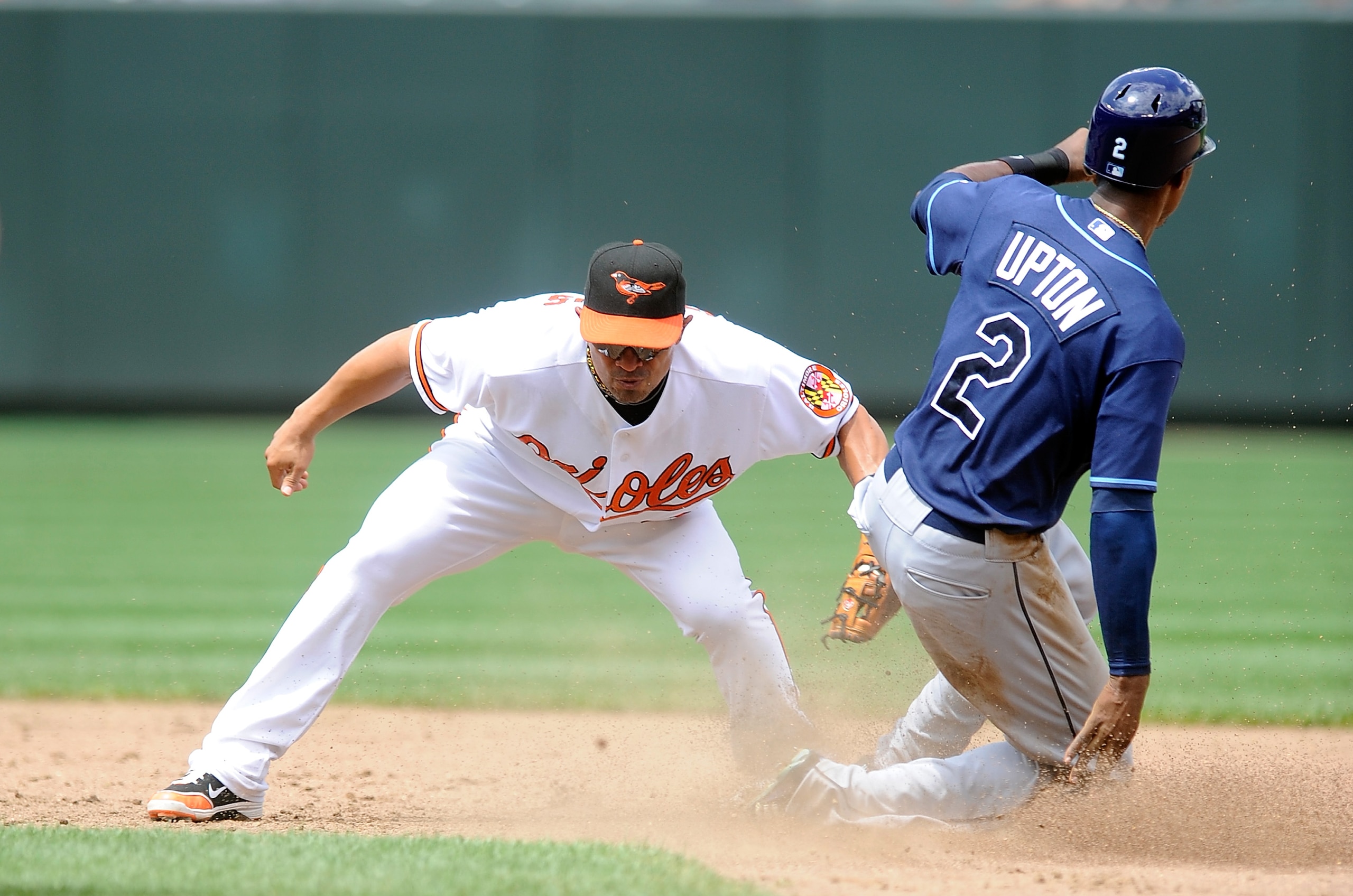BALTIMORE - JULY 21: B.J. Upton #2 of the Tampa Bay Rays steals second base ahead of the tag of Cesar Izturis #3 of the Baltimore Orioles at Camden Yards on July 21, 2010 in Baltimore, Maryland. (Photo by Greg Fiume/Getty Images) BALTIMORE - JULY 21: B.J. Upton #2 of the Tampa Bay Rays steals second base ahead of the tag of Cesar Izturis #3 of the Baltimore Orioles at Camden Yards on July 21, 2010 in Baltimore, Maryland. (Photo by Greg Fiume/Getty Images)