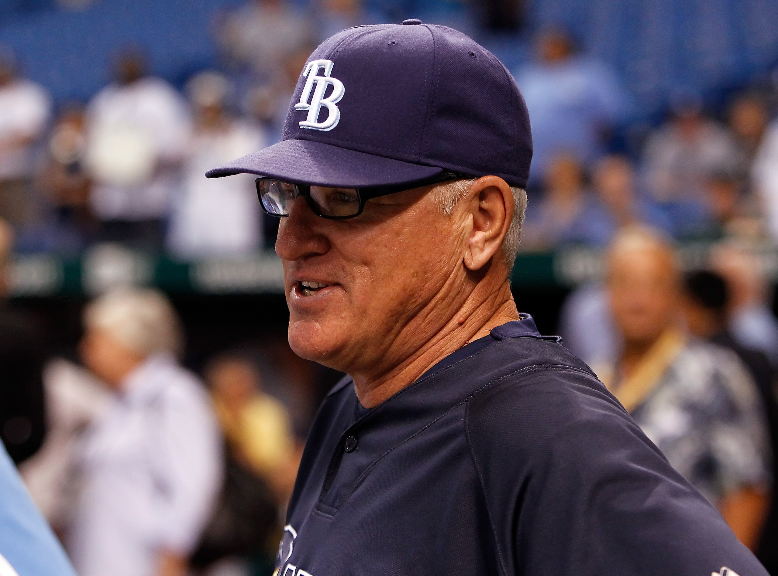 ST. PETERSBURG, FL - OCTOBER 12: Manager Joe Maddon #70 of the Tampa Bay Rays talks with some reporters during batting practice before the start of Game 5 of the ALDS against the Texas Rangers at Tropicana Field on October 12, 2010 in St. Petersburg, Flo ST. PETERSBURG, FL - OCTOBER 12: Manager Joe Maddon #70 of the Tampa Bay Rays talks with some reporters during batting practice before the start of Game 5 of the ALDS against the Texas Rangers at Tropicana Field on October 12, 2010 in St. Petersburg, Flo