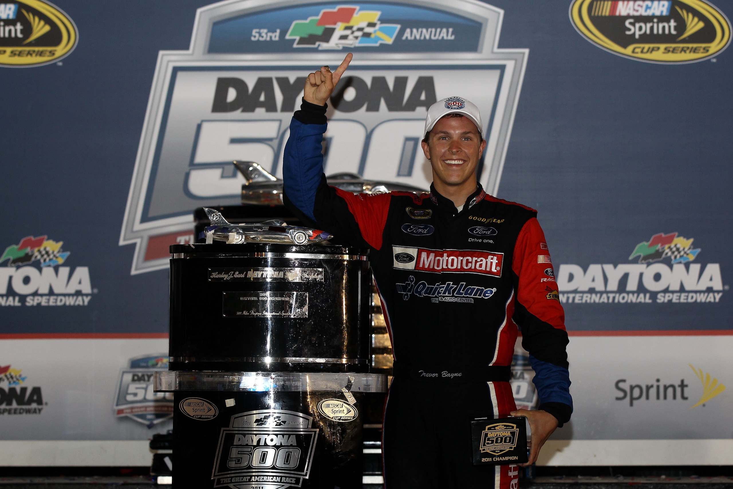 DAYTONA BEACH, FL - FEBRUARY 20:  Trevor Bayne, driver of the #21 Motorcraft/Quick Lane Ford, celebrates with the Harley J. Earl Trophy after winning the NASCAR Sprint Cup Series Daytona 500 at Daytona International Speedway on February 20, 2011 in Dayton