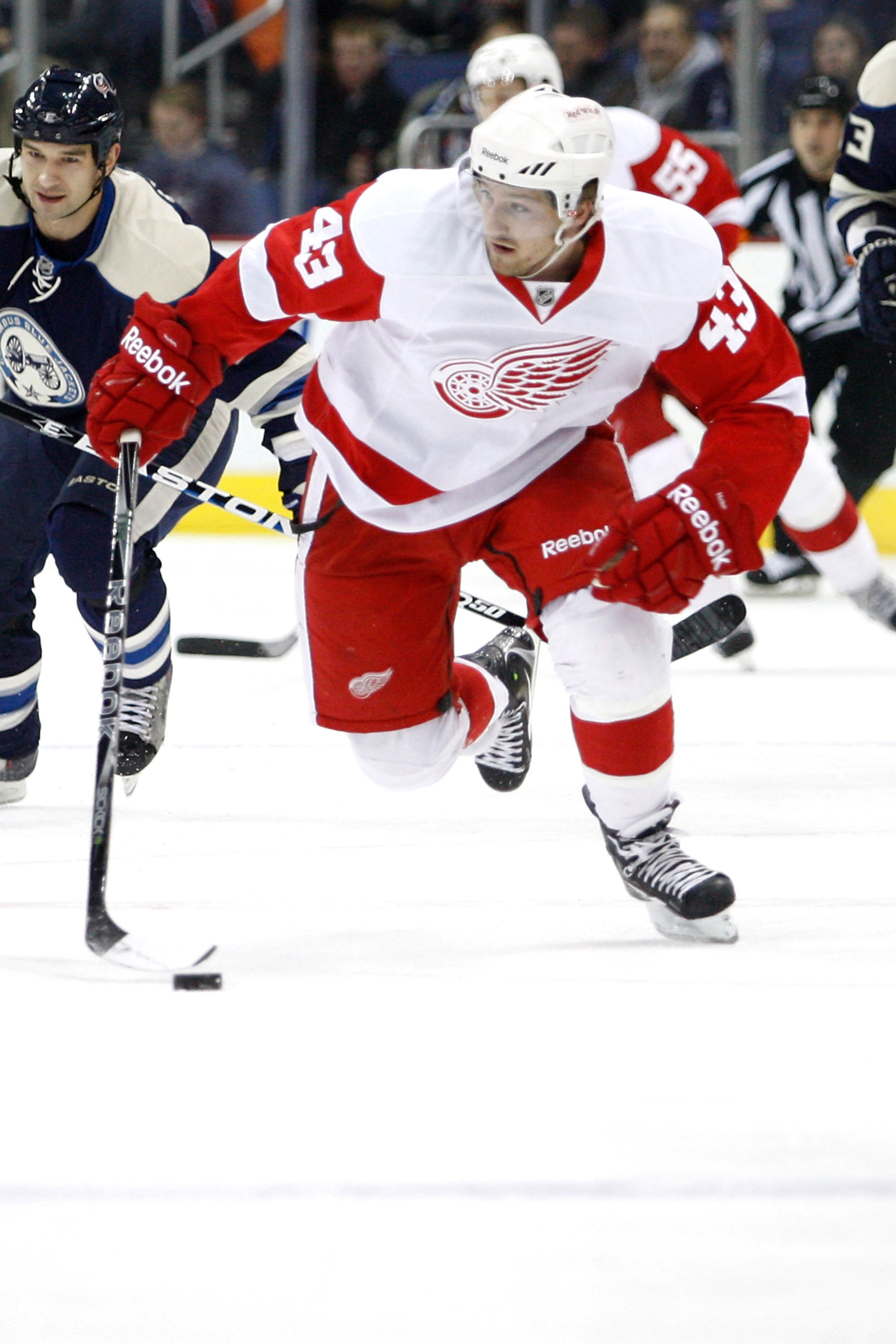 COLUMBUS, OH - JANUARY 14:  Darren Helm #43 of the Detroit Red Wings skates the puck up ice against the Columbus Blue Jackets on January 14, 2011 at Nationwide Arena in Columbus, Ohio. (Photo by John Grieshop/Getty Images)
