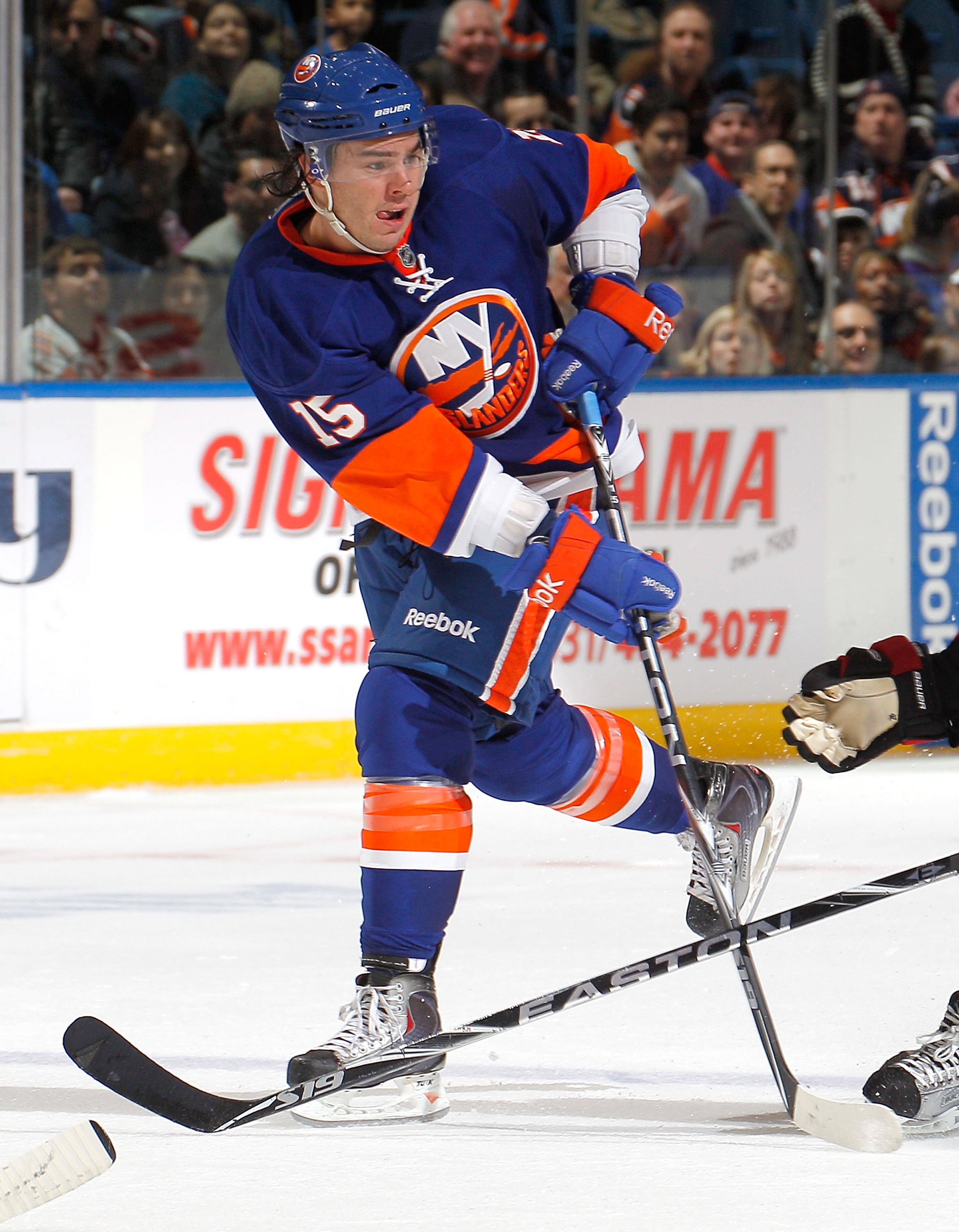 UNIONDALE, NY - FEBRUARY 05:  PA Parenteau #15 of the New York Islanders passes during an NHL hockey game against the Ottawa Senators at Nassau Coliseum on February 5, 2011 in Uniondale, New York.  (Photo by Paul Bereswill/Getty Images)
