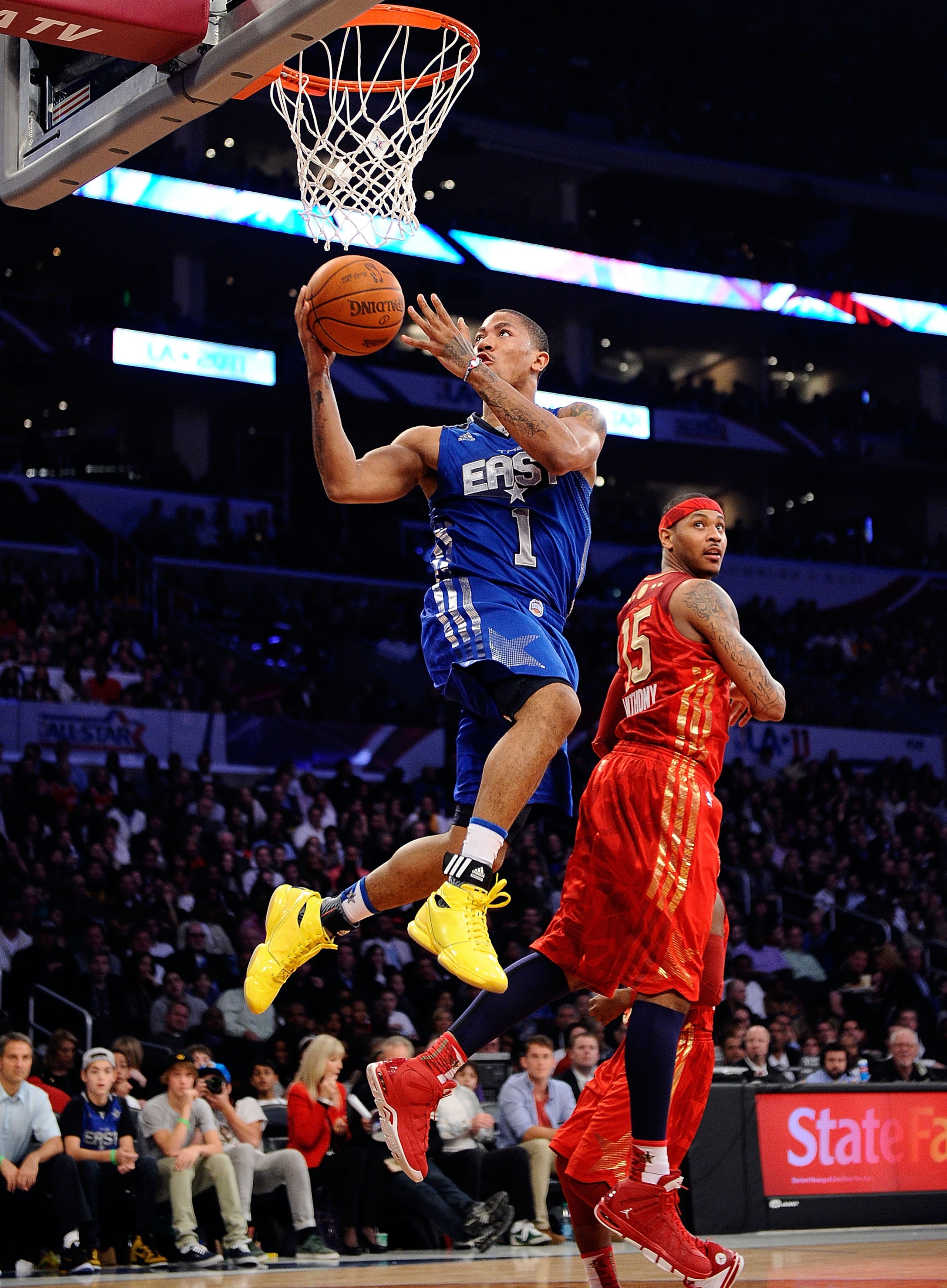 LOS ANGELES, CA - FEBRUARY 20: Derrick Rose #1 of the Chicago Bulls and the Eastern Conference goes up for a shot past Carmelo Anthony #15 of the Denver Nuggets and the Western Conference in the 2011 NBA All-Star Game at Staples Center on February 20, 20 LOS ANGELES, CA - FEBRUARY 20: Derrick Rose #1 of the Chicago Bulls and the Eastern Conference goes up for a shot past Carmelo Anthony #15 of the Denver Nuggets and the Western Conference in the 2011 NBA All-Star Game at Staples Center on February 20, 20