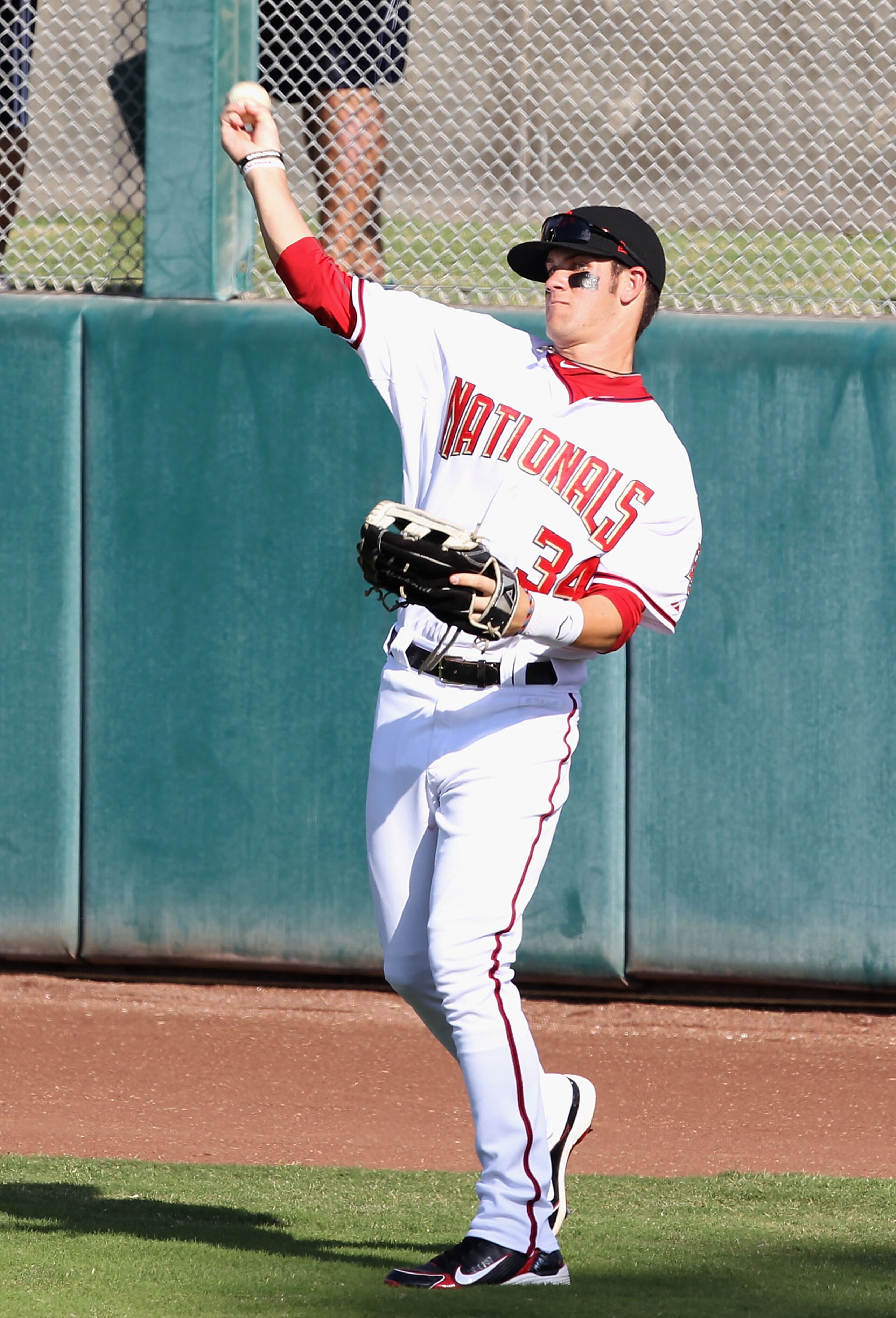 SCOTTSDALE, AZ - OCTOBER 23: Washington Nationals prospect Bryce Harper #34 playing for the Scottsdale Scorpions warms up in the outfield during the AZ Fall League game against the Phoenix Desert Dogs at Scottsdale Stadium on October 23, 2010 in Scottsda SCOTTSDALE, AZ - OCTOBER 23: Washington Nationals prospect Bryce Harper #34 playing for the Scottsdale Scorpions warms up in the outfield during the AZ Fall League game against the Phoenix Desert Dogs at Scottsdale Stadium on October 23, 2010 in Scottsda
