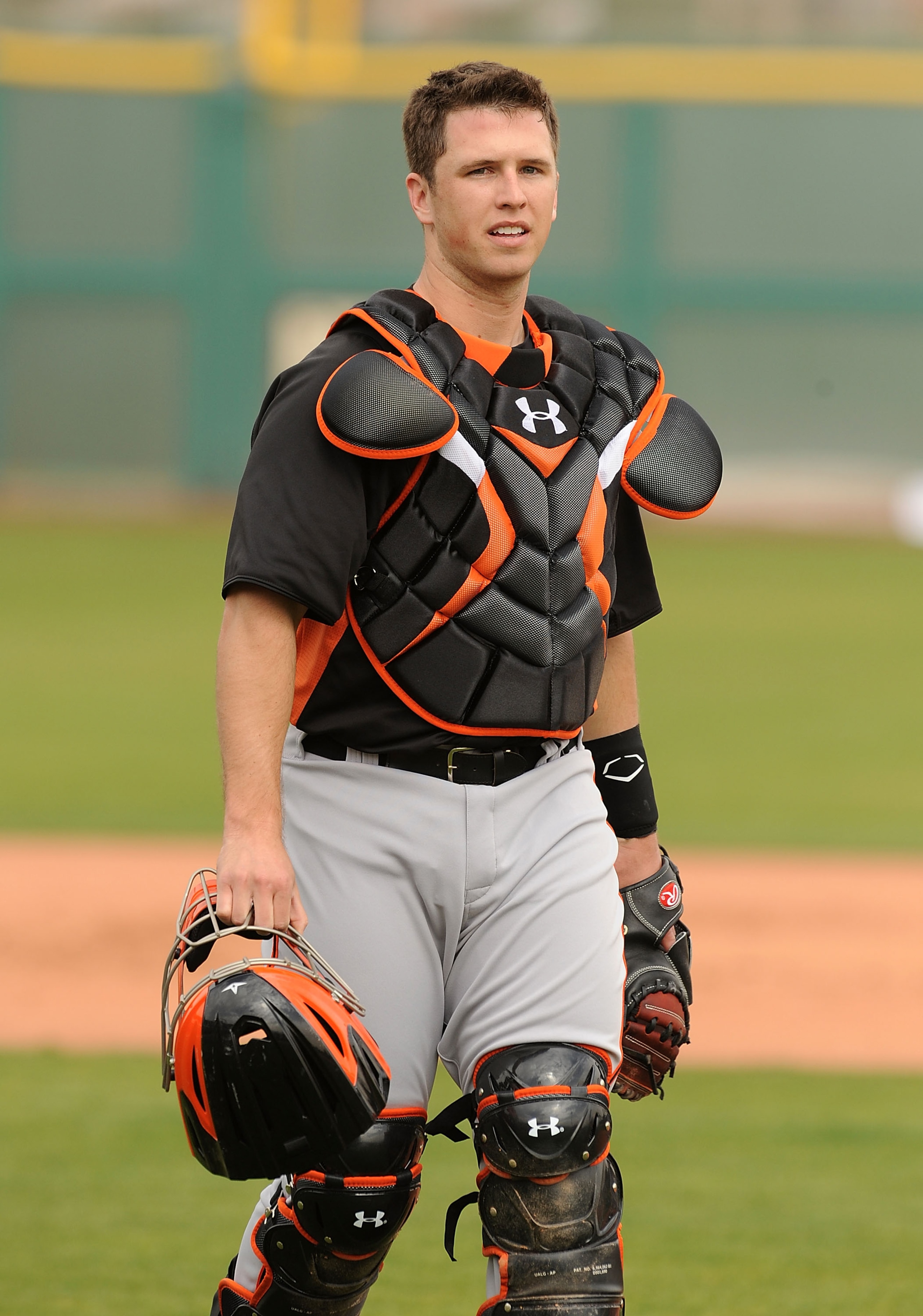 SCOTTSDALE, AZ - FEBRUARY 19:  Buster Posey #28 of the San Francisco Giants walks to the dugout after catching a session of live batting practice at Scottsdale Stadium on February 19, 2011 in Scottsdale, Arizona.  (Photo by Norm Hall/Getty Images)