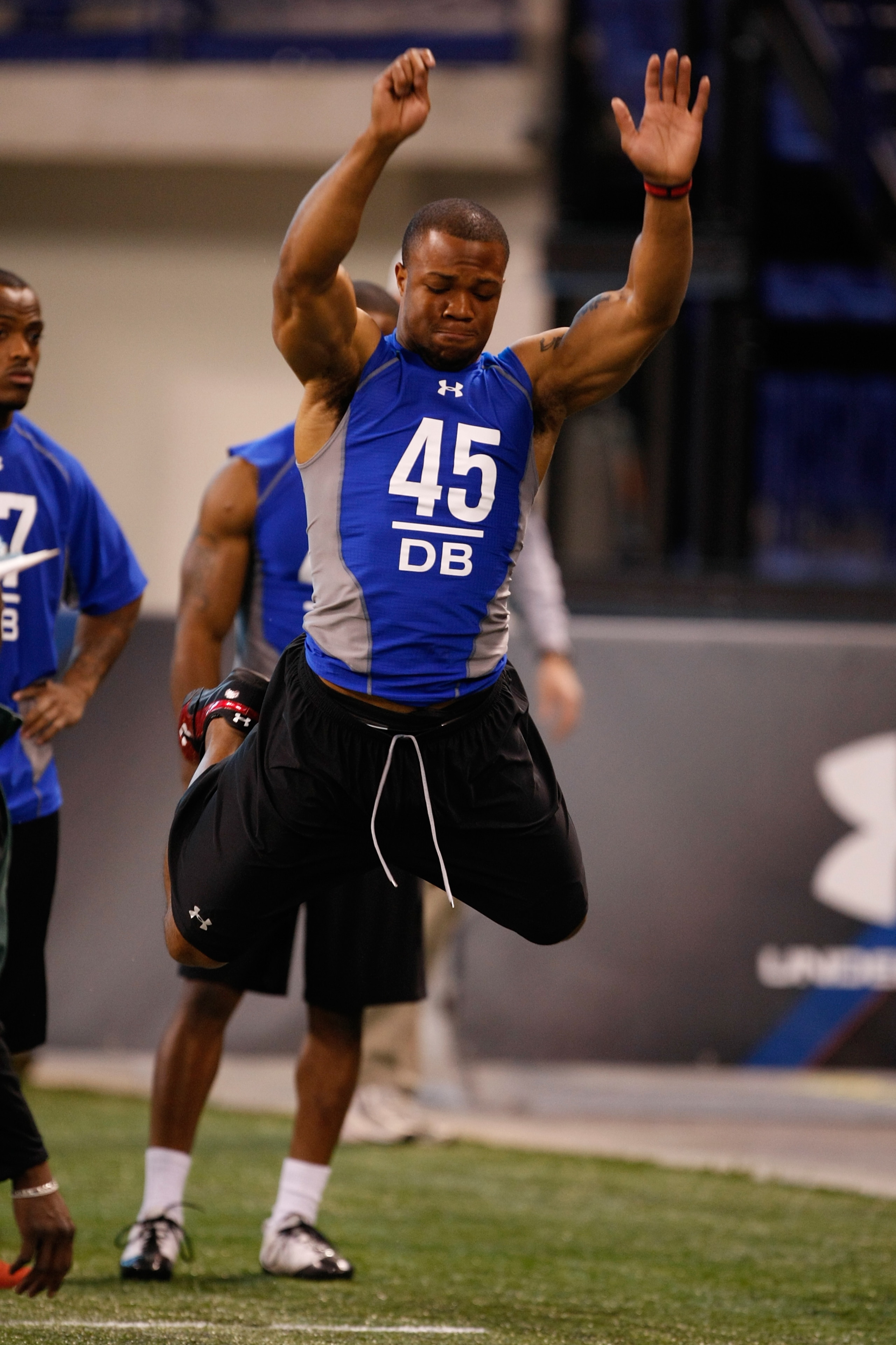 INDIANAPOLIS, IN - FEBRUARY 24:  Defensive back Glover Quinn of New Mexico jumps in the air at the broad jump during the NFL Scouting Combine at Lucas Oil Stadium on February 24, 2009 in Indianapolis, Indiana. (Photo by Scott Boehm/Getty Images)
