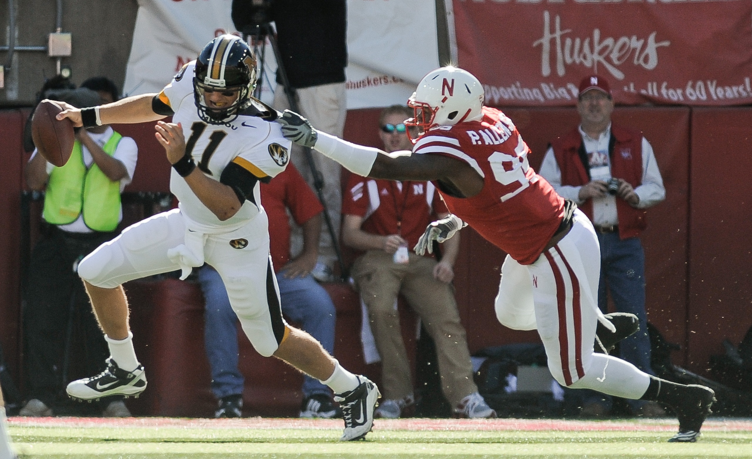 LINCOLN, NE - OCTOBER 30: Quarterback Blaine Gabbert #11 of the Missouri Tigers tries to avoid defensive end Pierre Allen #95 of the Nebraska Cornhuskers during first half action of their game at Memorial Stadium on October 30, 2010 in Lincoln, Nebraska.