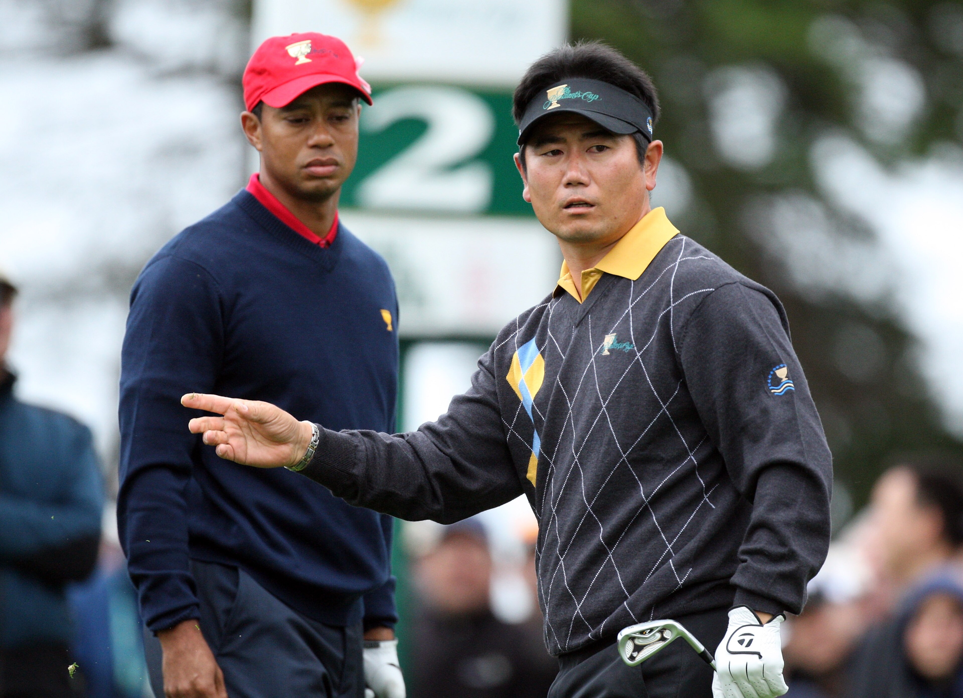 SAN FRANCISCO - OCTOBER 11: Y.E.Yang of South Korea and the International Team on the tee at the 2nd hole in hi smatch with Tiger Woods of the USA team during the Day Four Singles Matches in The Presidents Cup at Harding Park Golf Course on October 11, 2 SAN FRANCISCO - OCTOBER 11: Y.E.Yang of South Korea and the International Team on the tee at the 2nd hole in hi smatch with Tiger Woods of the USA team during the Day Four Singles Matches in The Presidents Cup at Harding Park Golf Course on October 11, 2