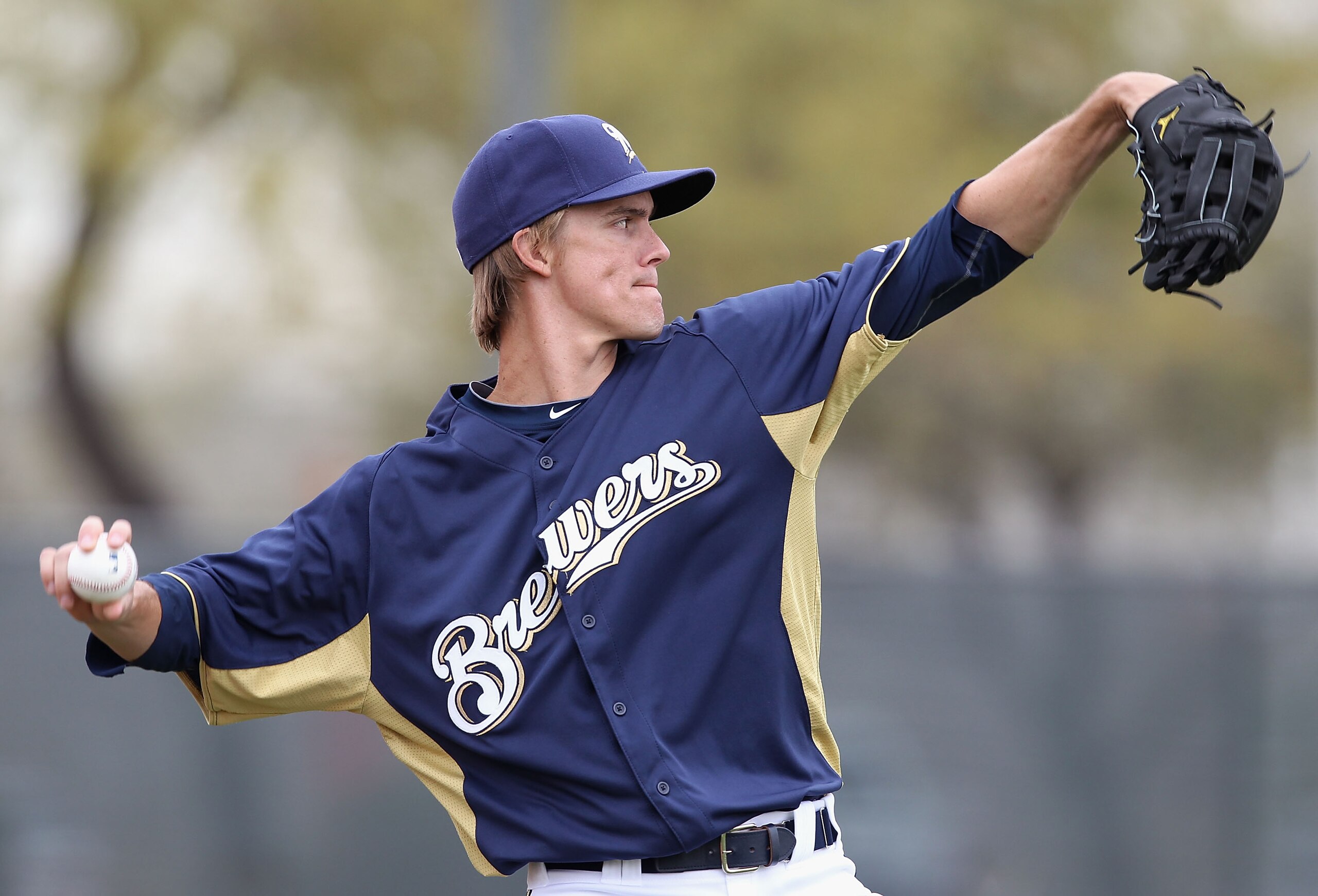 PHOENIX, AZ - FEBRUARY 18:  Pitcher Zack Greinke #13 of the Milwaukee Brewers warms up during a MLB spring training practice at Maryvale Baseball Park on February 18, 2011 in Phoenix, Arizona.  (Photo by Christian Petersen/Getty Images)