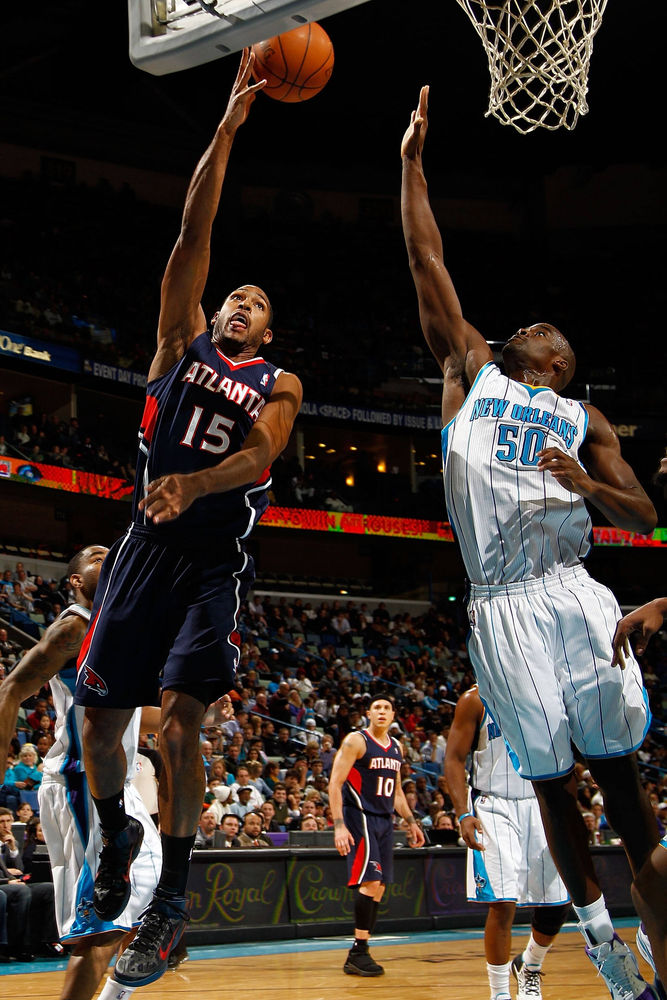 NEW ORLEANS, LA - DECEMBER 26: Al Horford #15 of the Atlanta Hawks shoots the ball over Emeka Okafor #50 of the New Orleans Hornets at the New Orleans Arena on December 26, 2010 in New Orleans, Louisiana. The Hornets defeated the Hawks 93-86. NOTE TO U NEW ORLEANS, LA - DECEMBER 26: Al Horford #15 of the Atlanta Hawks shoots the ball over Emeka Okafor #50 of the New Orleans Hornets at the New Orleans Arena on December 26, 2010 in New Orleans, Louisiana. The Hornets defeated the Hawks 93-86. NOTE TO U