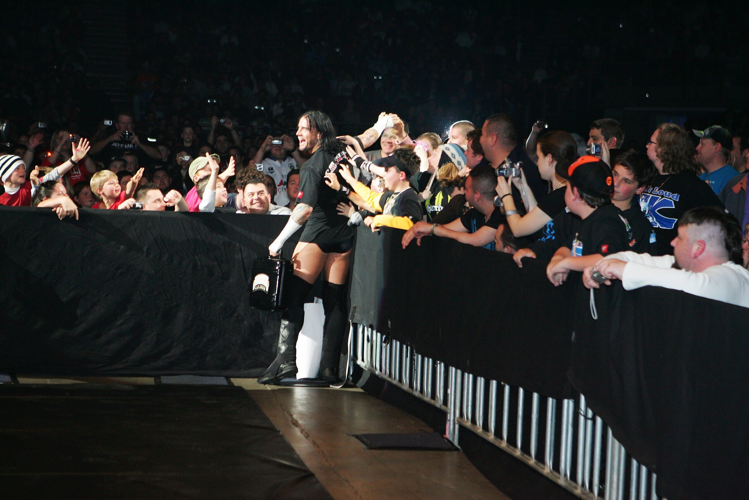 SYDNEY, AUSTRALIA - JUNE 15: CM Punk celebrates with fans before facing Shelton Benjamin during WWE Smackdown at Acer Arena on June 15, 2008 in Sydney, Australia. (Photo by Gaye Gerard/Getty Images) SYDNEY, AUSTRALIA - JUNE 15: CM Punk celebrates with fans before facing Shelton Benjamin during WWE Smackdown at Acer Arena on June 15, 2008 in Sydney, Australia. (Photo by Gaye Gerard/Getty Images)