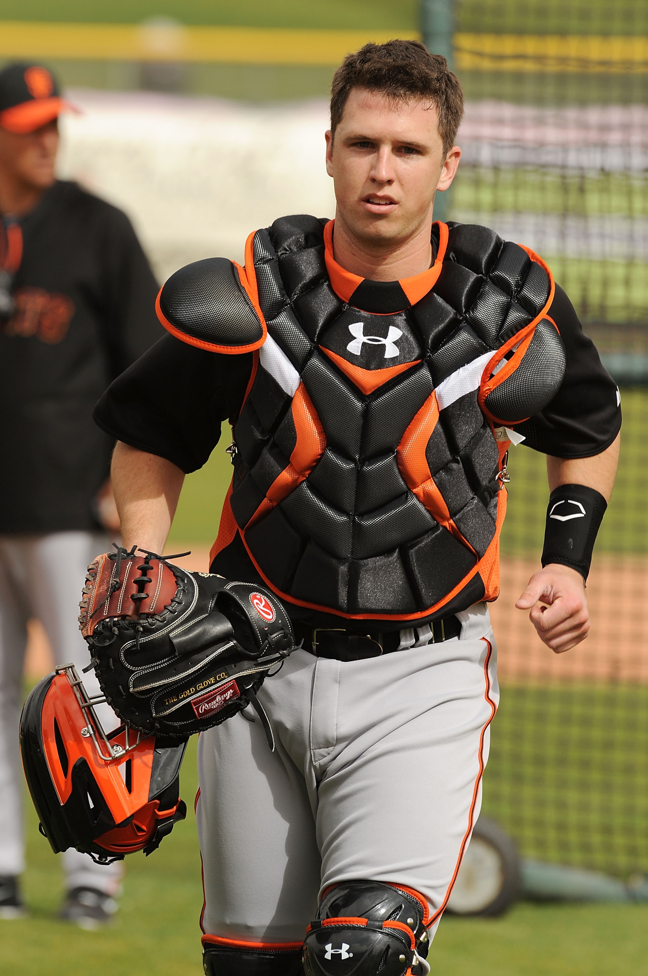 SCOTTSDALE, AZ - FEBRUARY 19:  Buster Posey #28 of the San Francisco Giants heads back to the plate after talking to one of the pitchers during live batting practice at Scottsdale Stadium on February 19, 2011 in Scottsdale, Arizona.  (Photo by Norm Hall/G