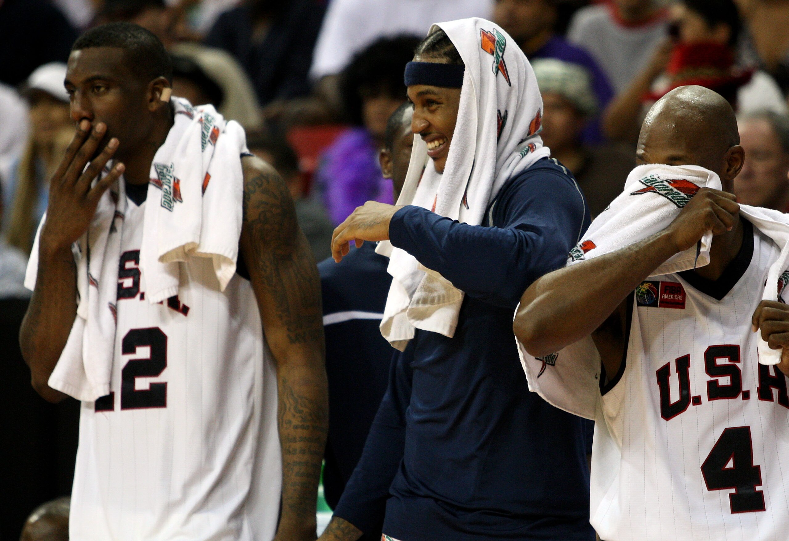 LAS VEGAS - SEPTEMBER 2:  Amare Stoudemire #12, Carmelo Anthony #15, and Chauncey Billups #4 of the USA react from the bench as they watch teammates score during the FIBA Americas Championship 2007 Gold Medal game against Argentina at Thomas & Mack Center