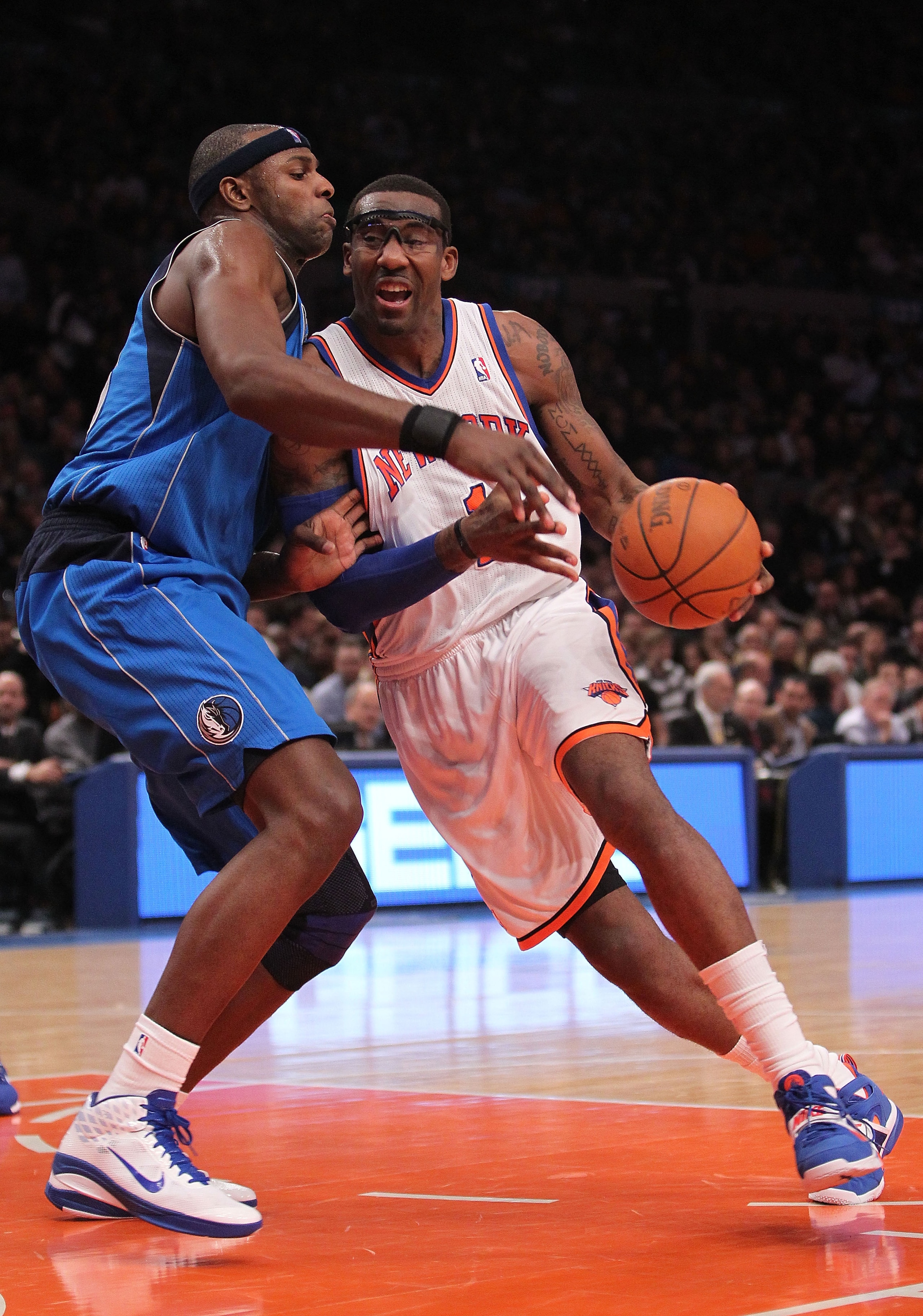 NEW YORK, NY - FEBRUARY 02:  Amar'e Stoudemire #1 of the New York Knicks drives to the basket against Brendan Haywood #33 of the Dallas Mavericks at Madison Square Garden on February 2, 2011 in New York City. NOTE TO USER: User expressly acknowledges and