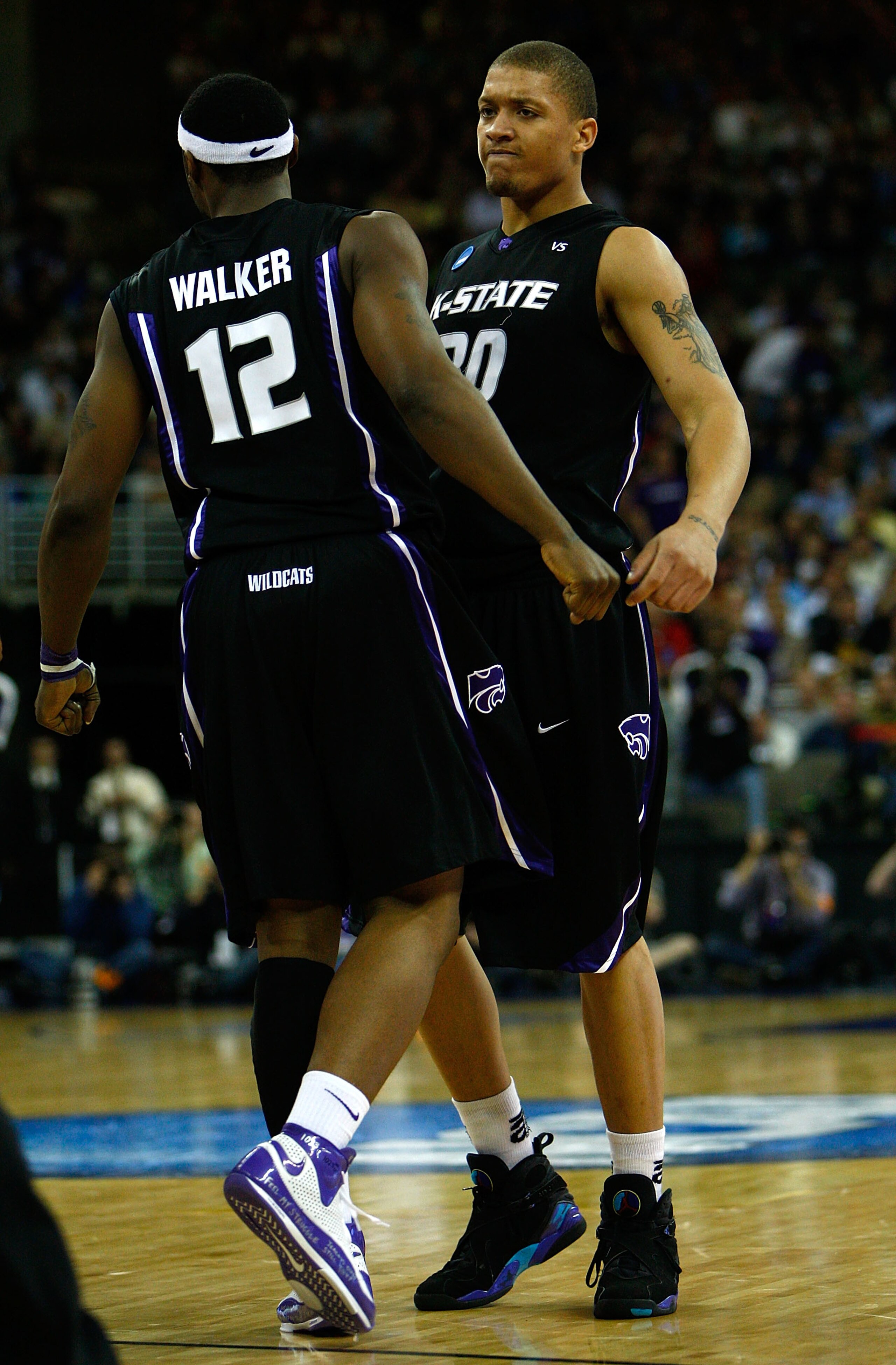 OMAHA, NE - MARCH 20: Michael Beasley (R) #30 and Bill Walker #12 of the Kansas State Wildcats celebrate a play against the USC Trojans during the Midwest Region first round of the 2008 NCAA Men's Basketball Tournament on March 20, 2008 at the Qwest Cent OMAHA, NE - MARCH 20: Michael Beasley (R) #30 and Bill Walker #12 of the Kansas State Wildcats celebrate a play against the USC Trojans during the Midwest Region first round of the 2008 NCAA Men's Basketball Tournament on March 20, 2008 at the Qwest Cent