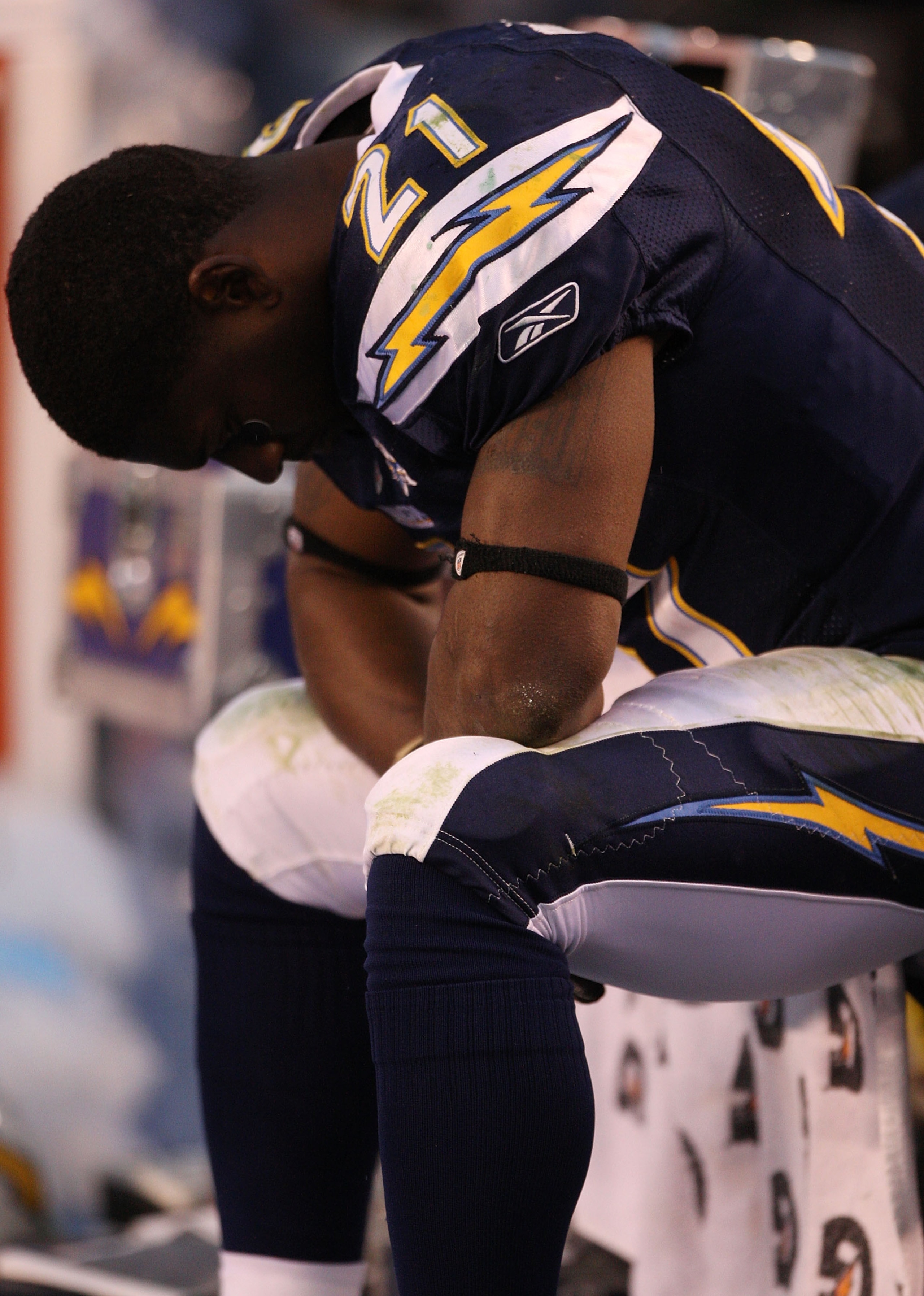 SAN DIEGO - JANUARY 17: Running back LaDainian Tomlinson #21 of the San Diego Chargers sits on the bench in the final moments of the AFC Divisional Playoff Game against the New York Jets at Qualcomm Stadium on January 17, 2010 in San Diego, California. T SAN DIEGO - JANUARY 17: Running back LaDainian Tomlinson #21 of the San Diego Chargers sits on the bench in the final moments of the AFC Divisional Playoff Game against the New York Jets at Qualcomm Stadium on January 17, 2010 in San Diego, California. T