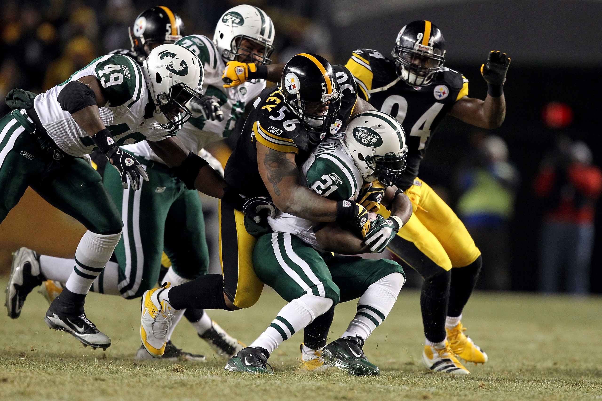 PITTSBURGH, PA - JANUARY 23: LaMarr Woodley #56 of the Pittsburgh Steelers tackles LaDainian Tomlinson #21 of the New York Jets during the 2011 AFC Championship game at Heinz Field on January 23, 2011 in Pittsburgh, Pennsylvania. The Steelers won 24-19. PITTSBURGH, PA - JANUARY 23: LaMarr Woodley #56 of the Pittsburgh Steelers tackles LaDainian Tomlinson #21 of the New York Jets during the 2011 AFC Championship game at Heinz Field on January 23, 2011 in Pittsburgh, Pennsylvania. The Steelers won 24-19.