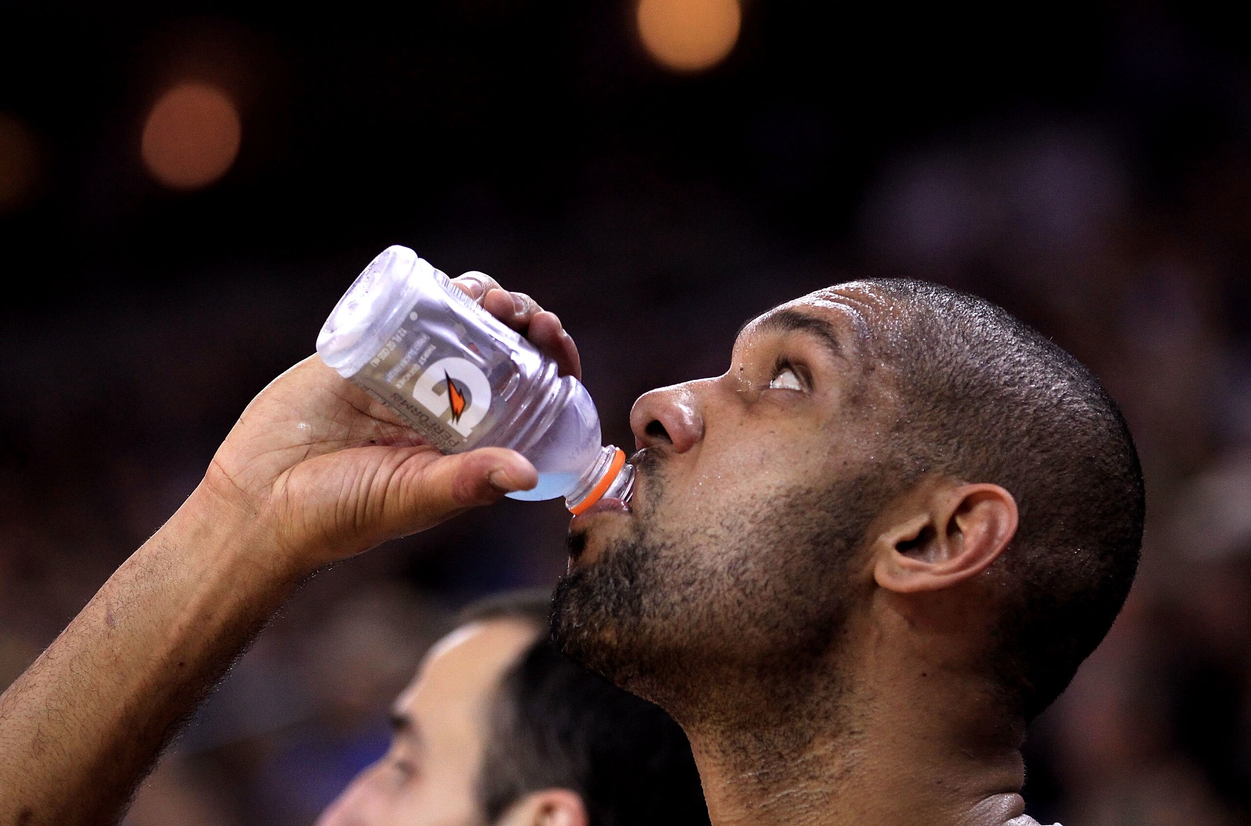 OAKLAND, CA - JANUARY 24:  Tim Duncan #21 of the San Antonio Spurs drinks a Gatorade while sitting on the bench during their game against the Golden State Warriors at Oracle Arena on January 24, 2011 in Oakland, California.  NOTE TO USER: User expressly a