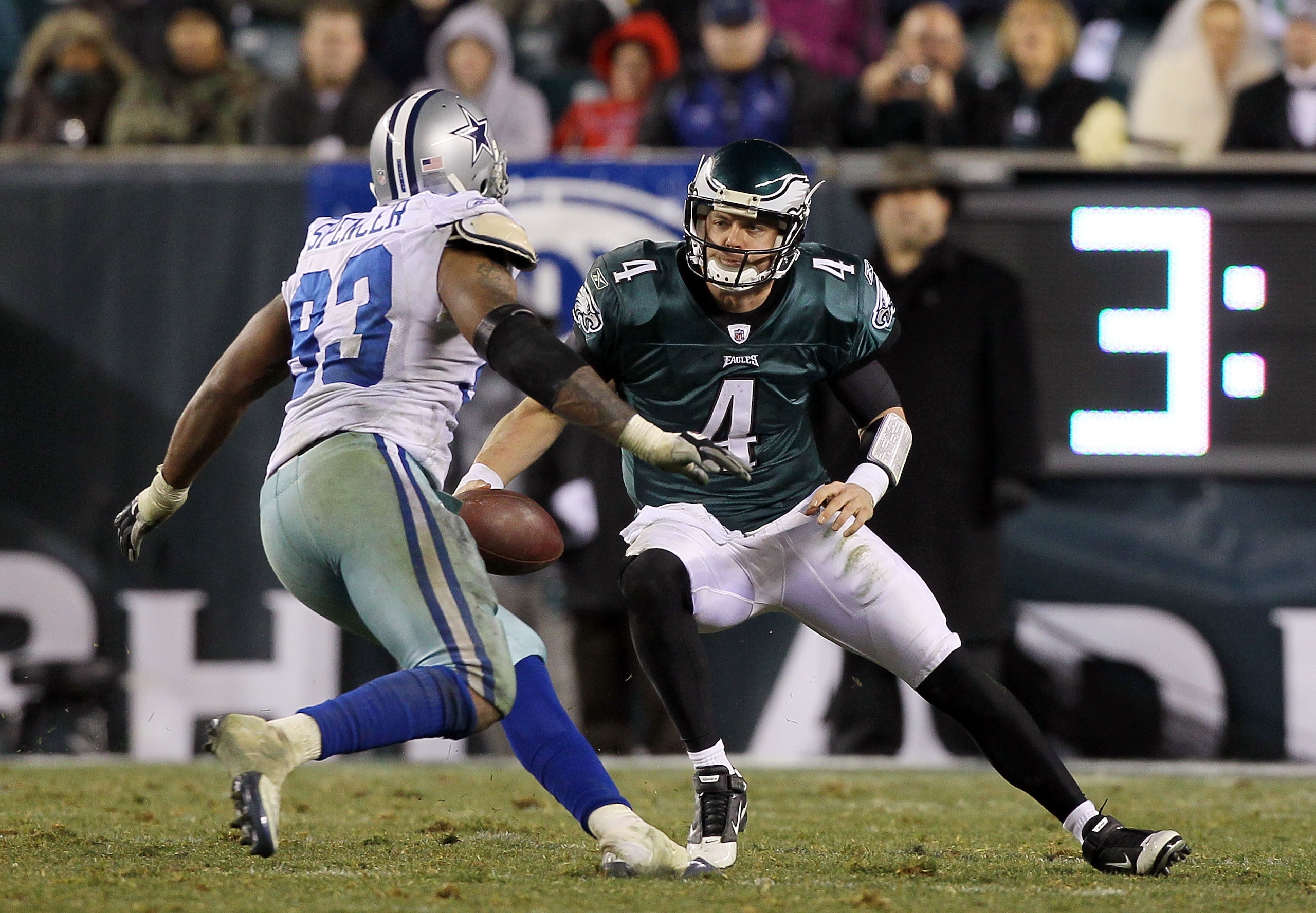 PHILADELPHIA, PA - JANUARY 02:  Kevin Kolb #4 of the Philadelphia Eagles tries to avoid a sack from Anthony Spencer #93 of the Dallas Cowboys on January 2, 2011 at Lincoln Financial Field in Philadelphia, Pennsylvania. The Cowboys defeated the Eagles 14-1