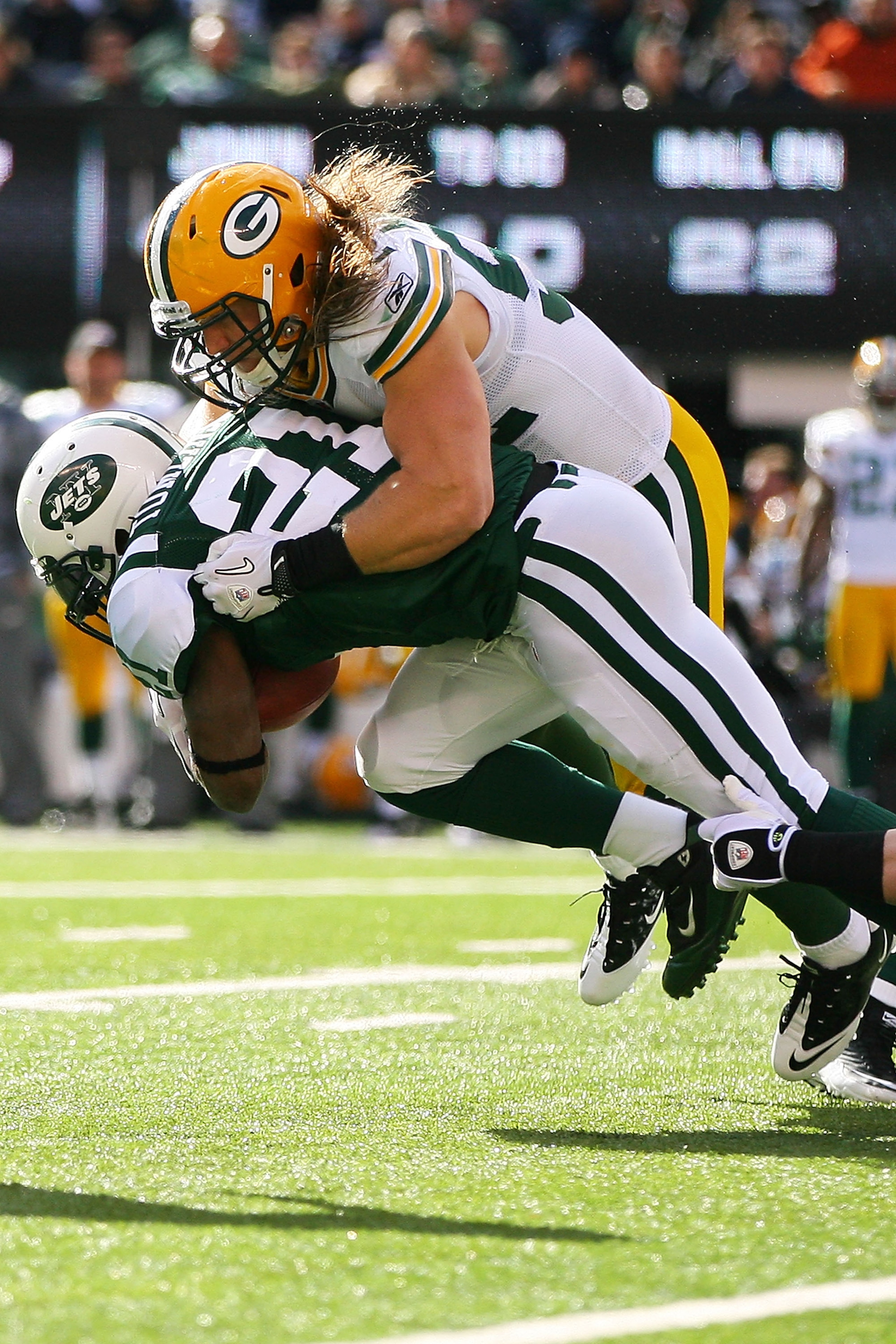 EAST RUTHERFORD, NJ - OCTOBER 31: Clay Matthews #52 of the Green Bay Packers tackles LaDainian Tomlinson #21 of the New York Jets on October 31, 2010 at the New Meadowlands Stadium in East Rutherford, New Jersey. The Packers defeated the Jets 9 - 0. (P EAST RUTHERFORD, NJ - OCTOBER 31: Clay Matthews #52 of the Green Bay Packers tackles LaDainian Tomlinson #21 of the New York Jets on October 31, 2010 at the New Meadowlands Stadium in East Rutherford, New Jersey. The Packers defeated the Jets 9 - 0. (P