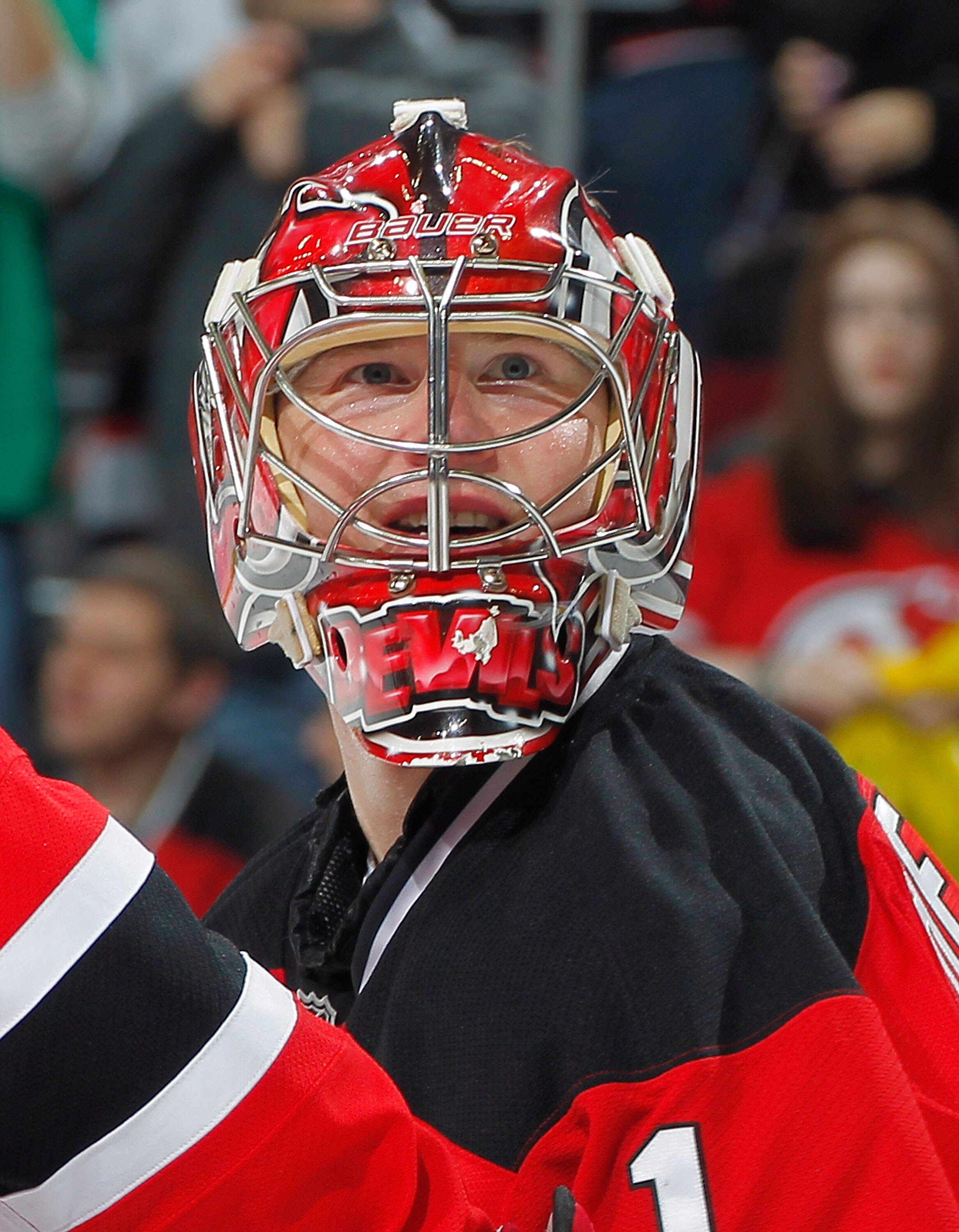 NEWARK, NJ - FEBRUARY 11: Goalie Johan Hedberg #1 of the New Jersey Devils smiles as he looks up to the crowd after a Devils win in an NHL hockey game against the San Jose Sharks on February 11, 2011 at the Prudential Center in Newark, New Jersey. (Photo
