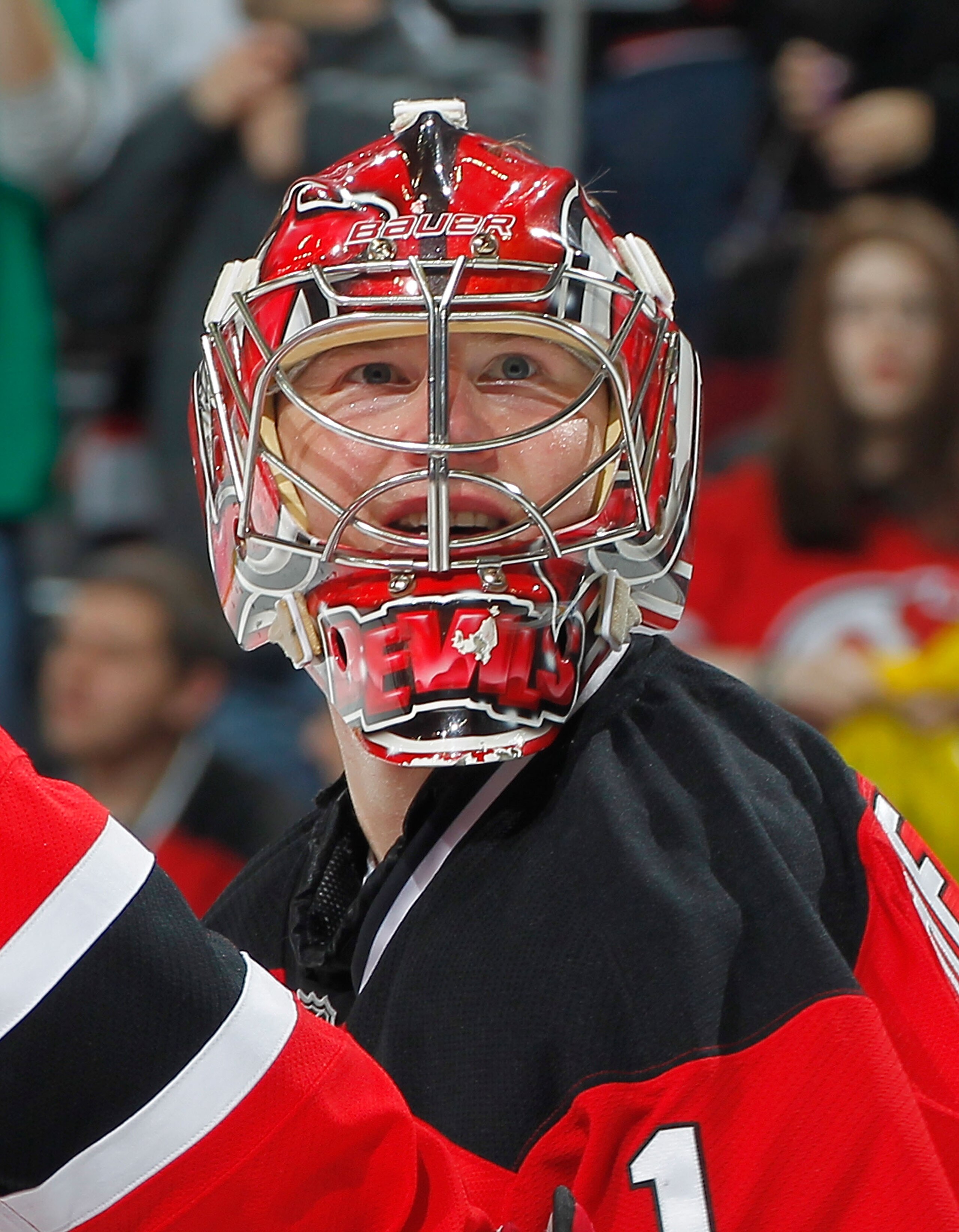 NEWARK, NJ - FEBRUARY 11: Goalie Johan Hedberg #1 of the New Jersey Devils smiles as he looks up to the crowd after a Devils win in an NHL hockey game against the San Jose Sharks on February 11, 2011 at the Prudential Center in Newark, New Jersey. (Photo